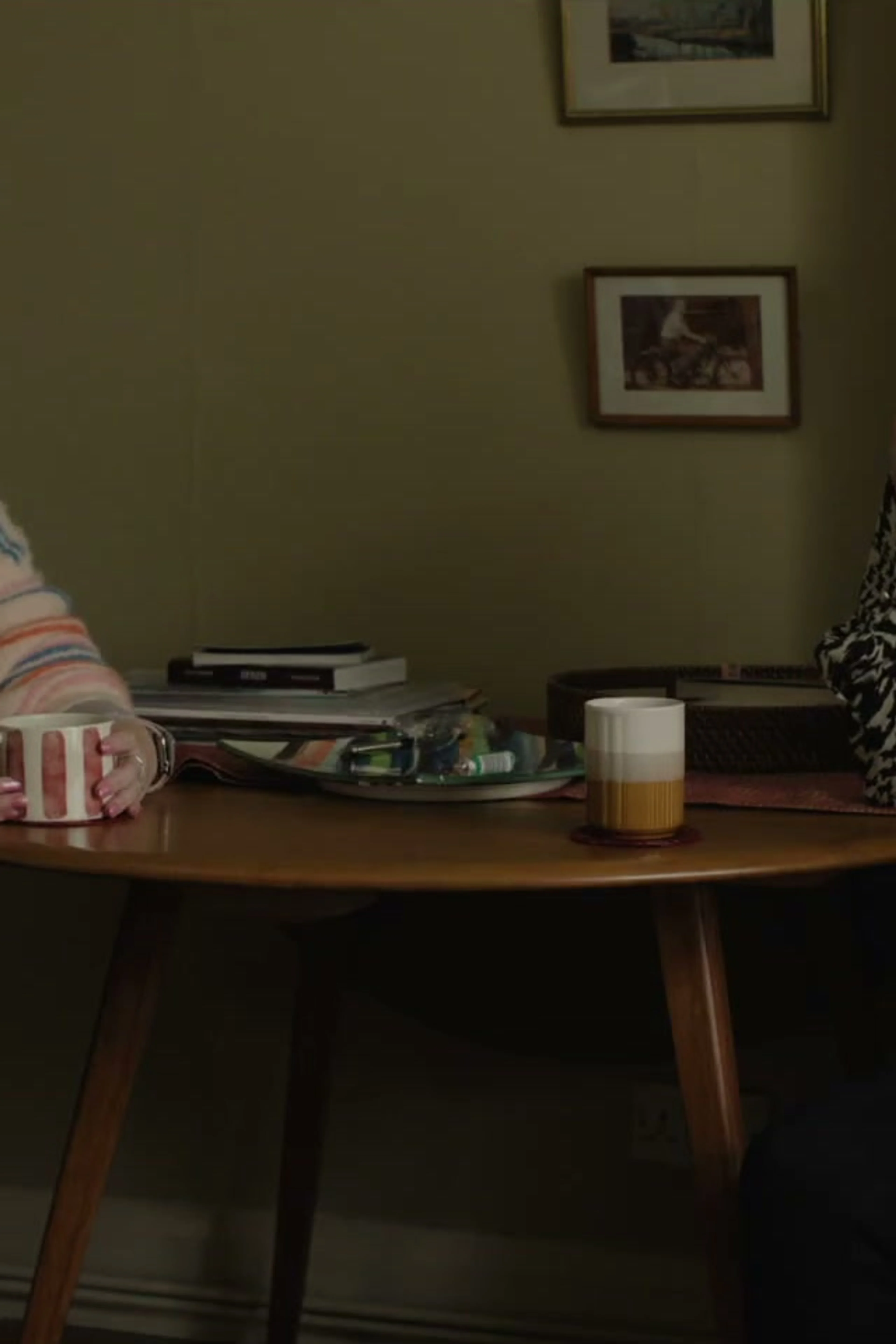 Amy and Rosie talk at a kitchen table in Tender Loving Care.