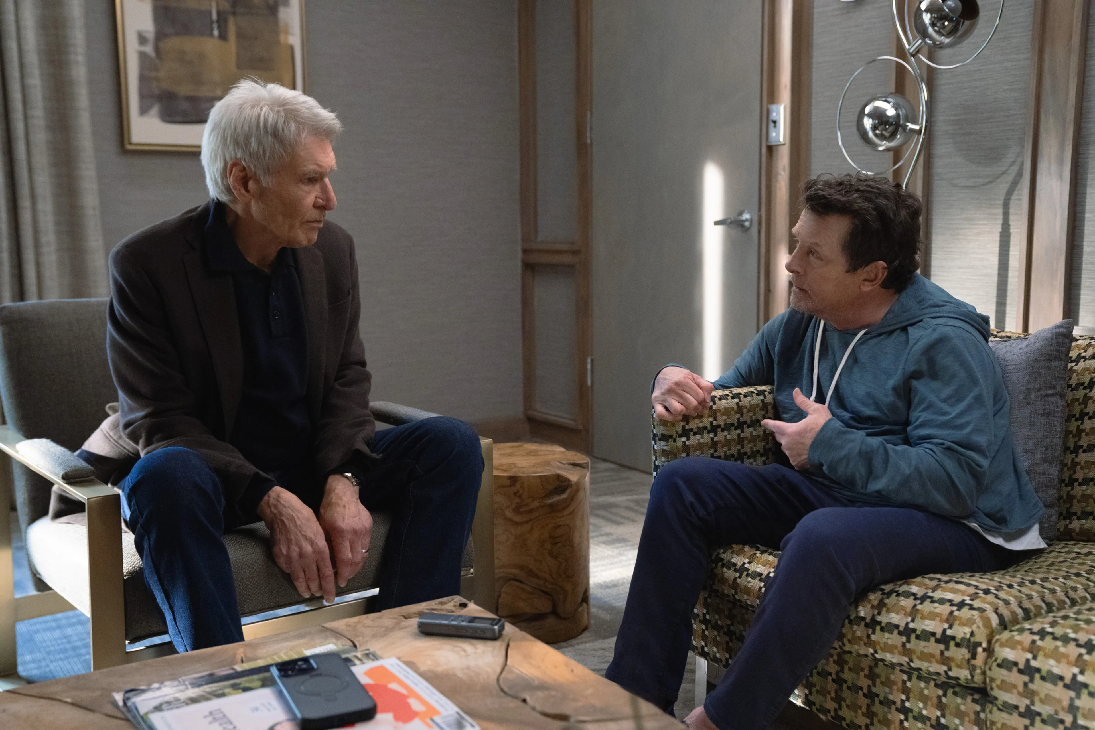 Harrison Ford and Michael J. Fox sit together in Shrinking.