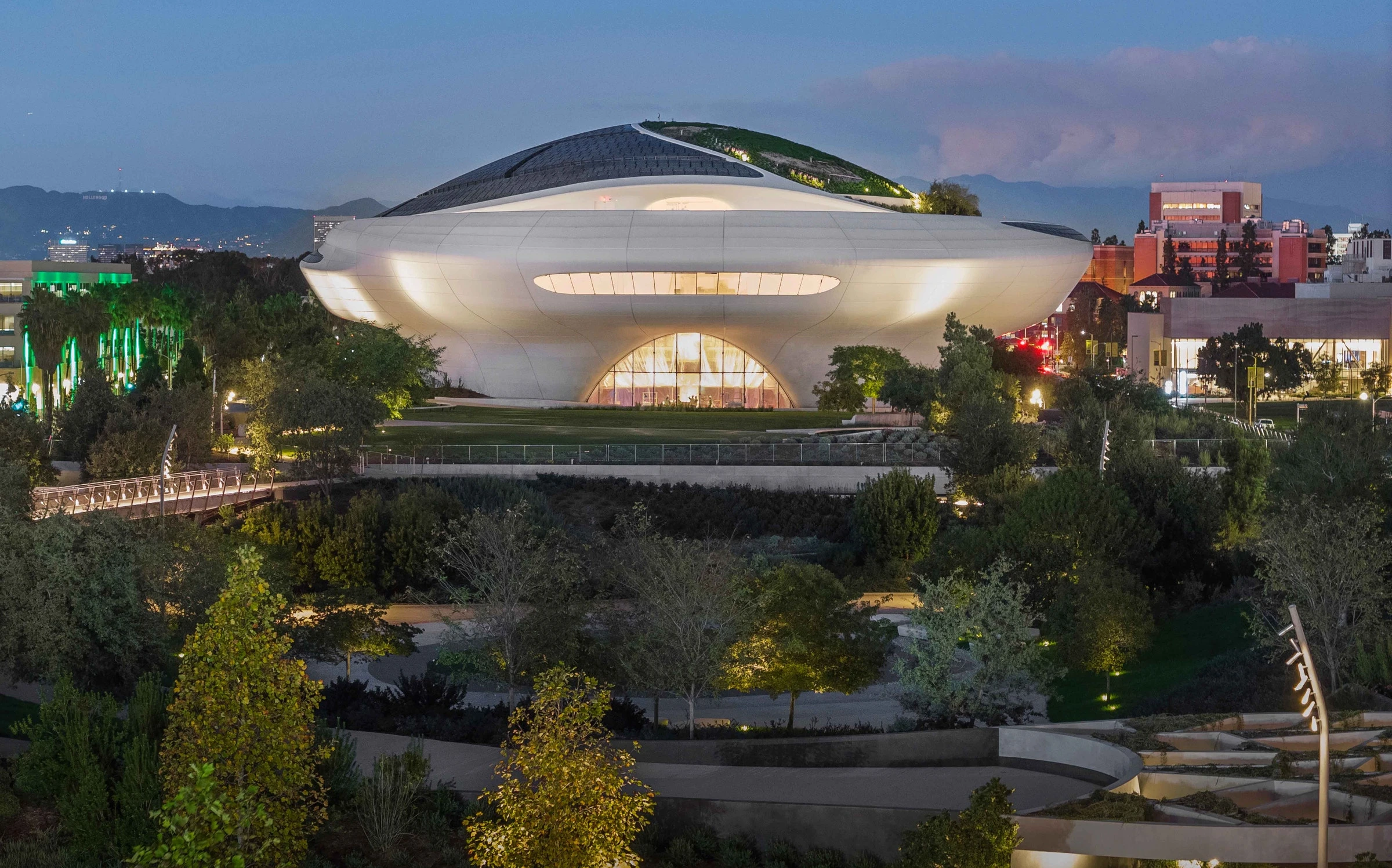 The Lucas Museum of Narrative Art glows at dusk in Los Angeles.