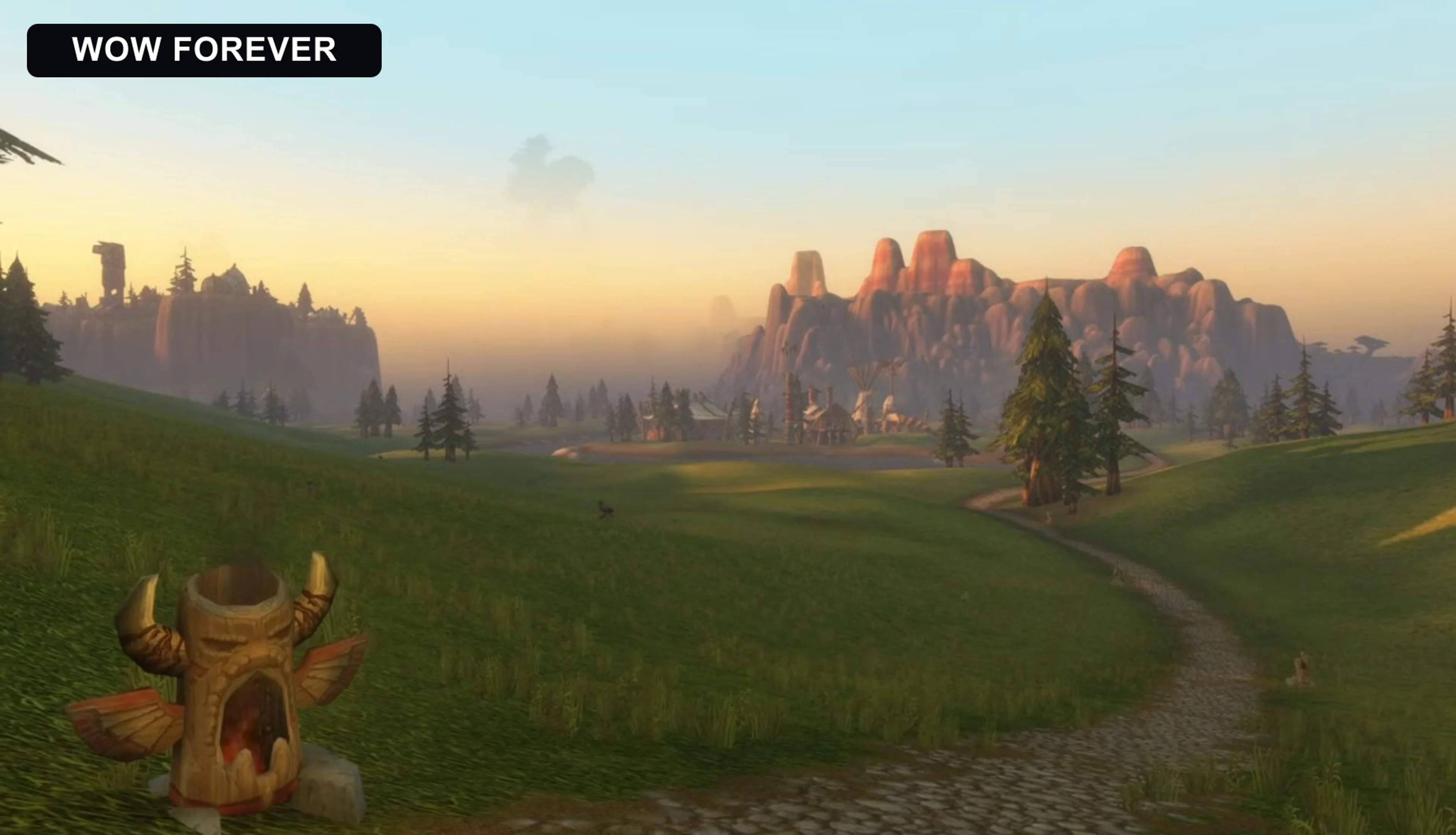 The same World of Warcraft landscape in Forever with visible mountains, fog and greener grass.