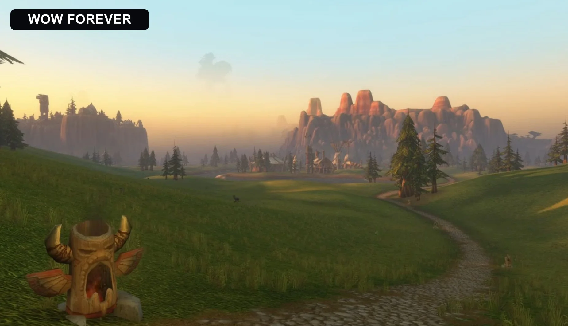 The same World of Warcraft landscape in Forever with visible mountains, fog and greener grass.