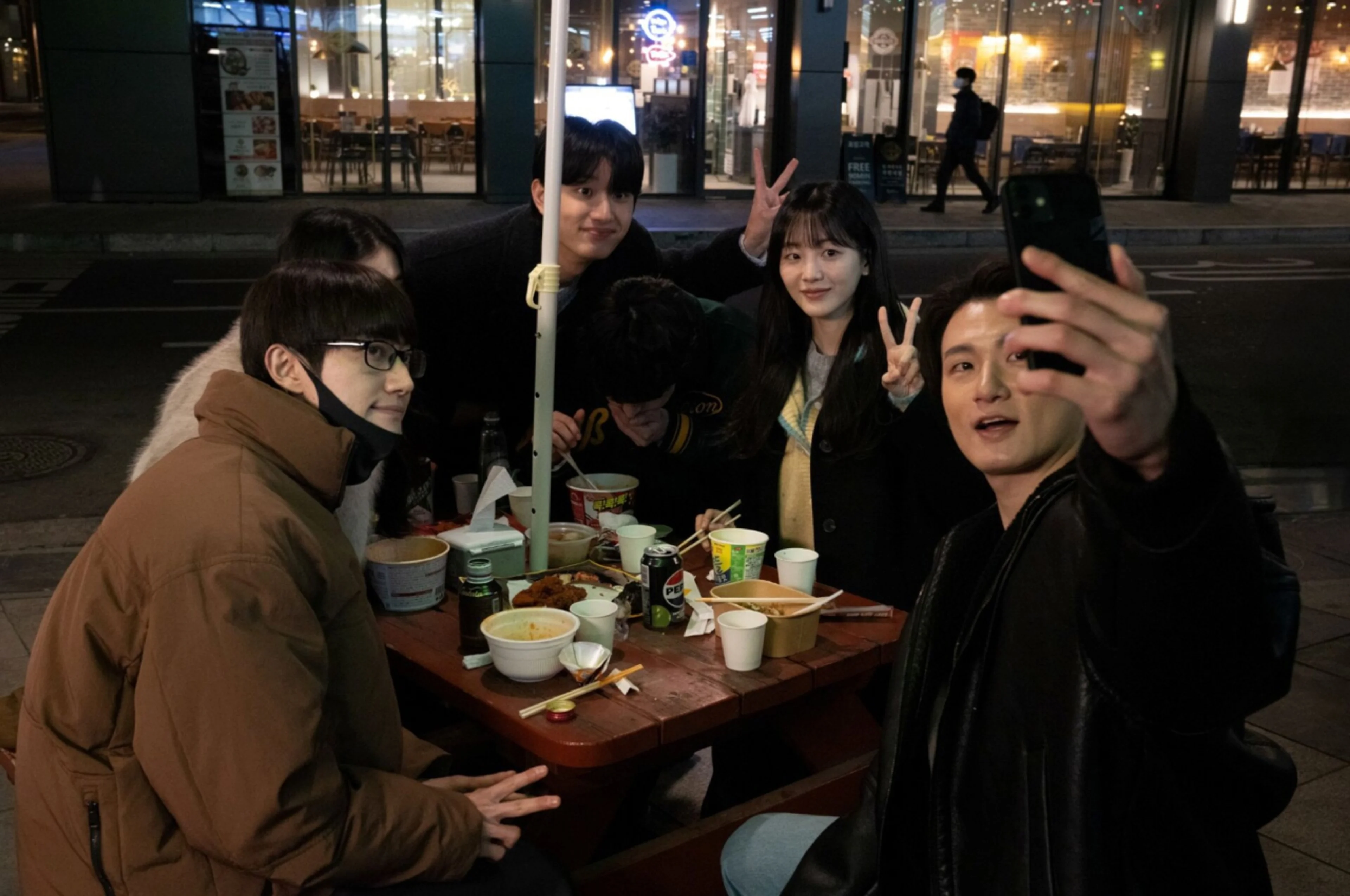Applicants gather for a selfie before the tension rises in the Korean film Final Interview.