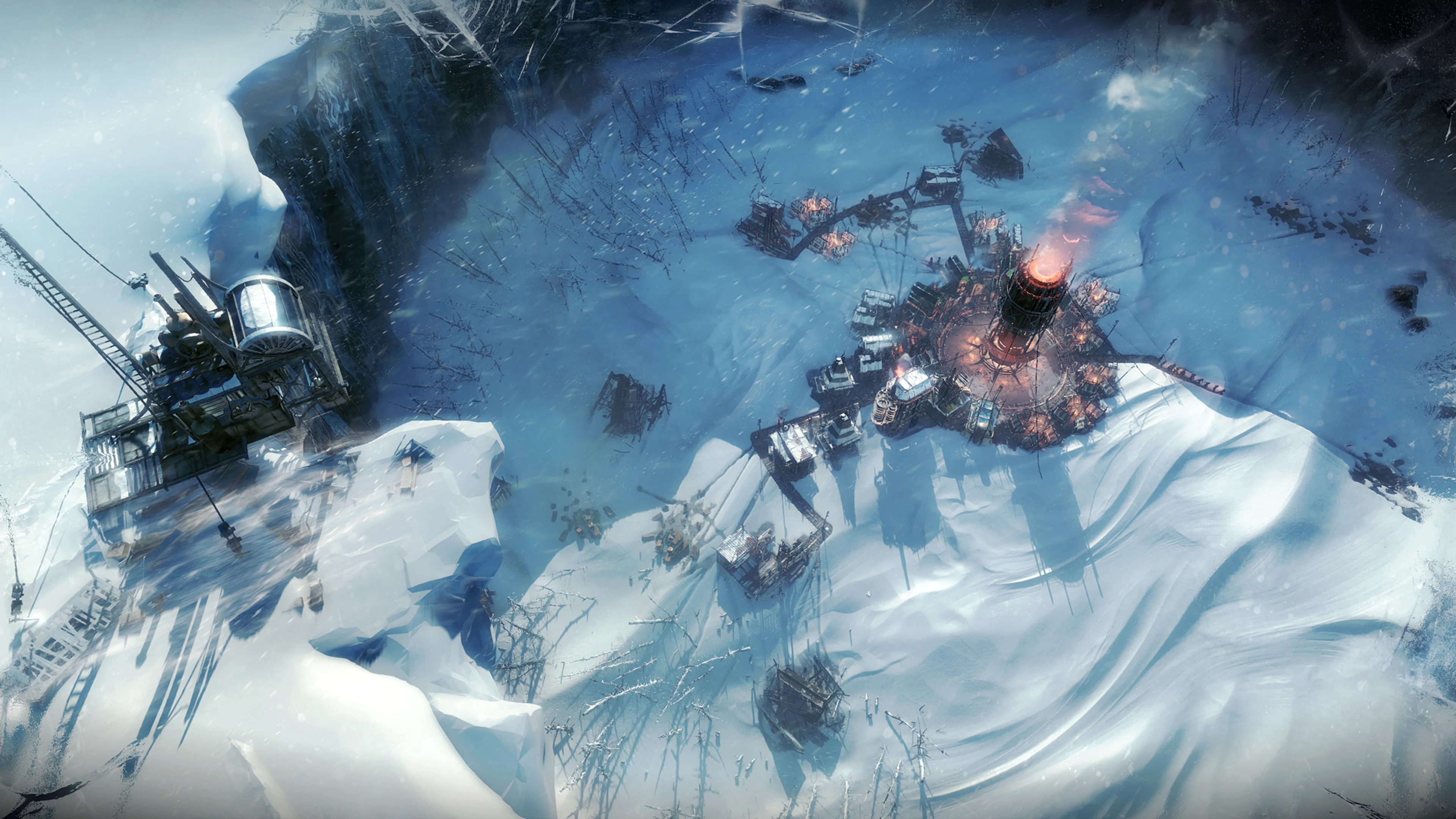 Official Frostpunk screenshot of a small snowy settlement with the tall, glowing generator near the centre-right.