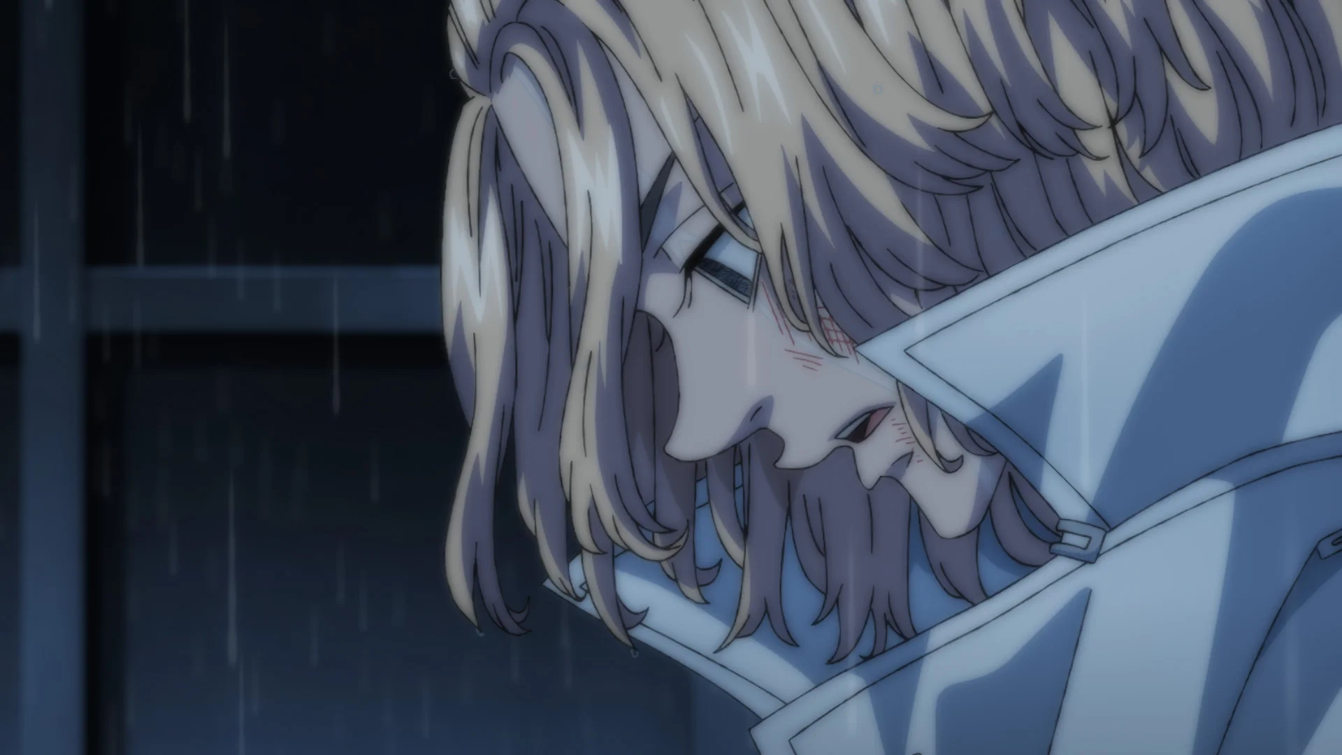 A bruised Mikey looks down in a rain-soaked frame from the official Tokyo Revengers Season 4 trailer.