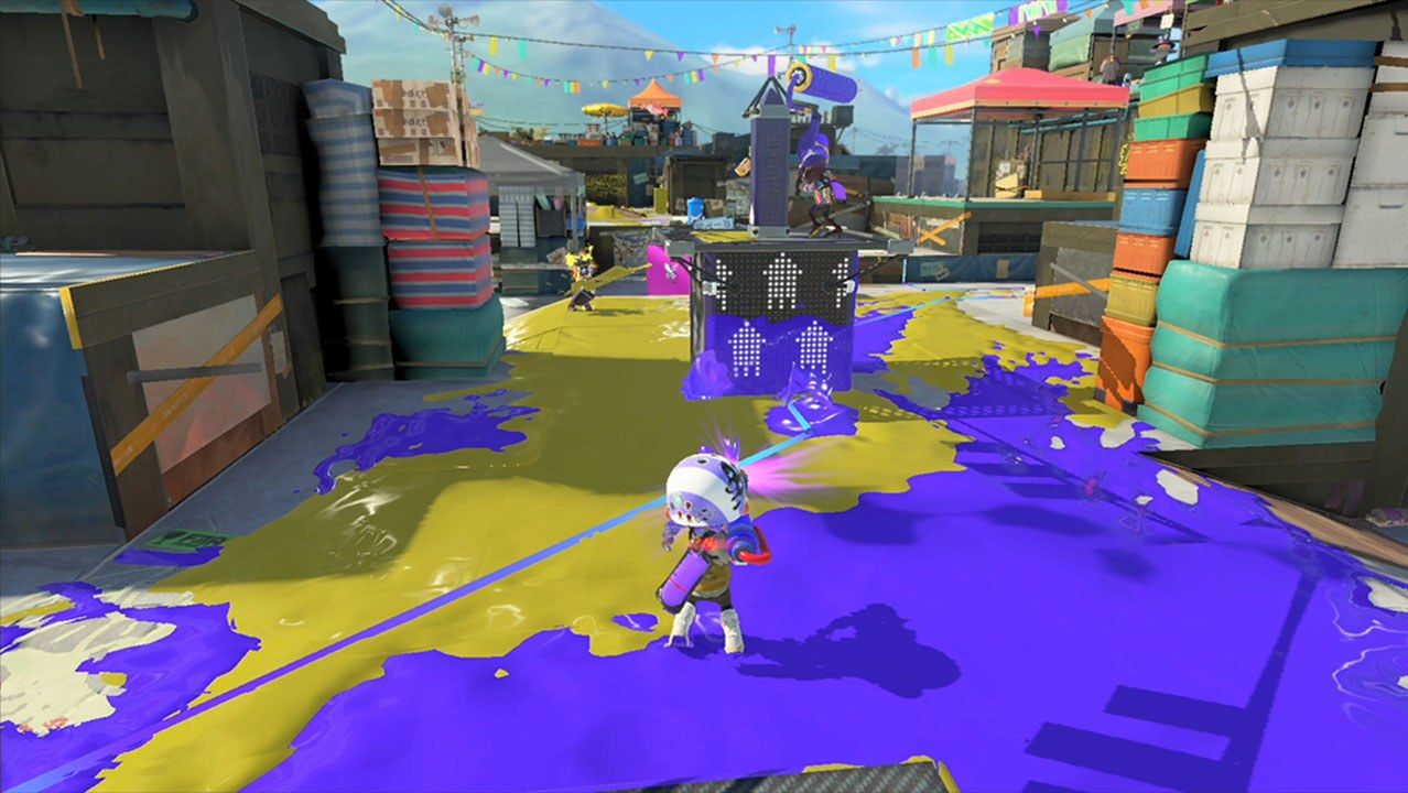 A player pushes into an ink-covered objective area.