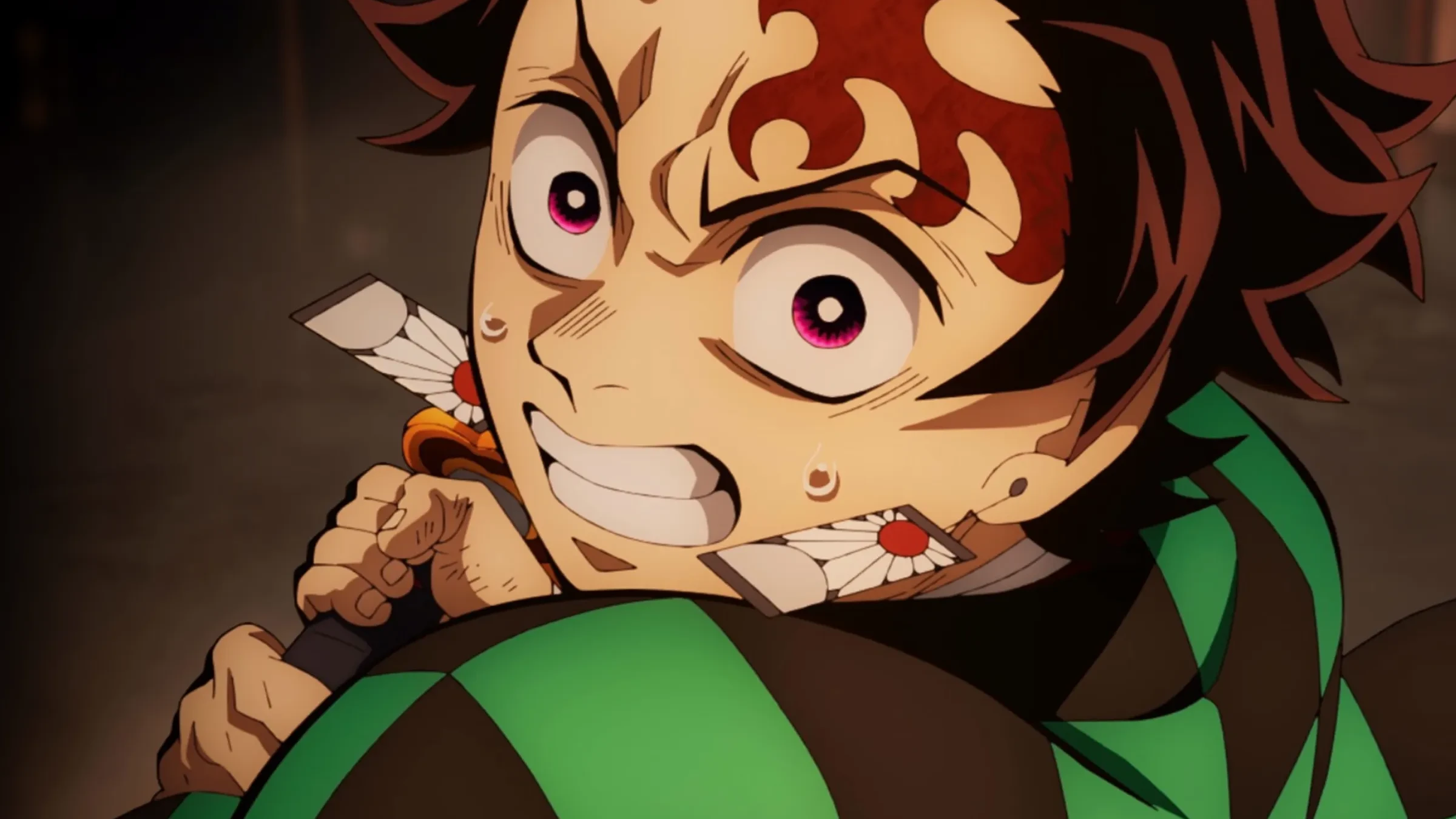Tanjiro Kamado grips his sword inside the Infinity Castle.