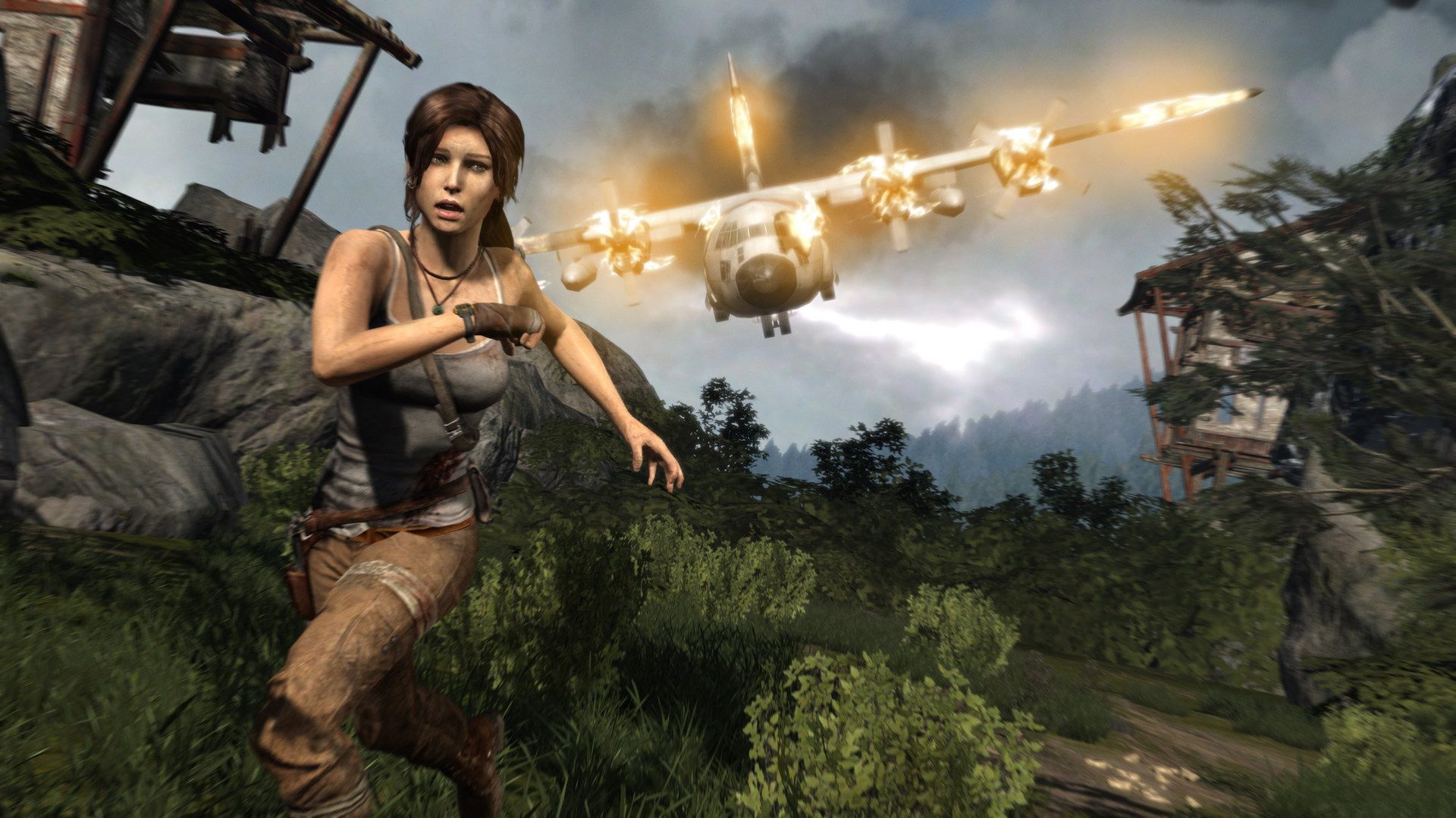 Lara Croft stands with a bow near a crashed plane in a lush part of the island.