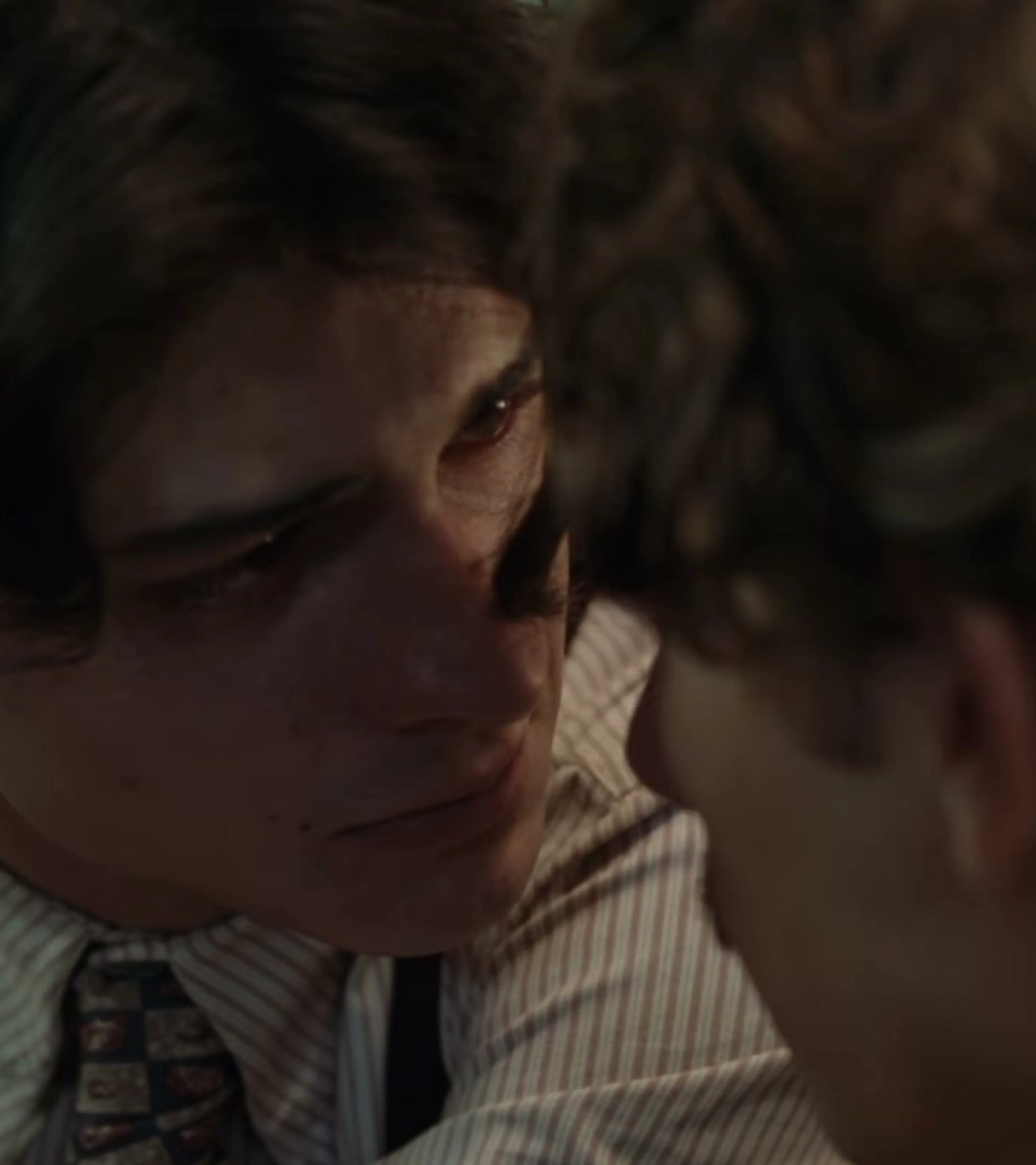 Two young men face each other closely in La Bola Negra.