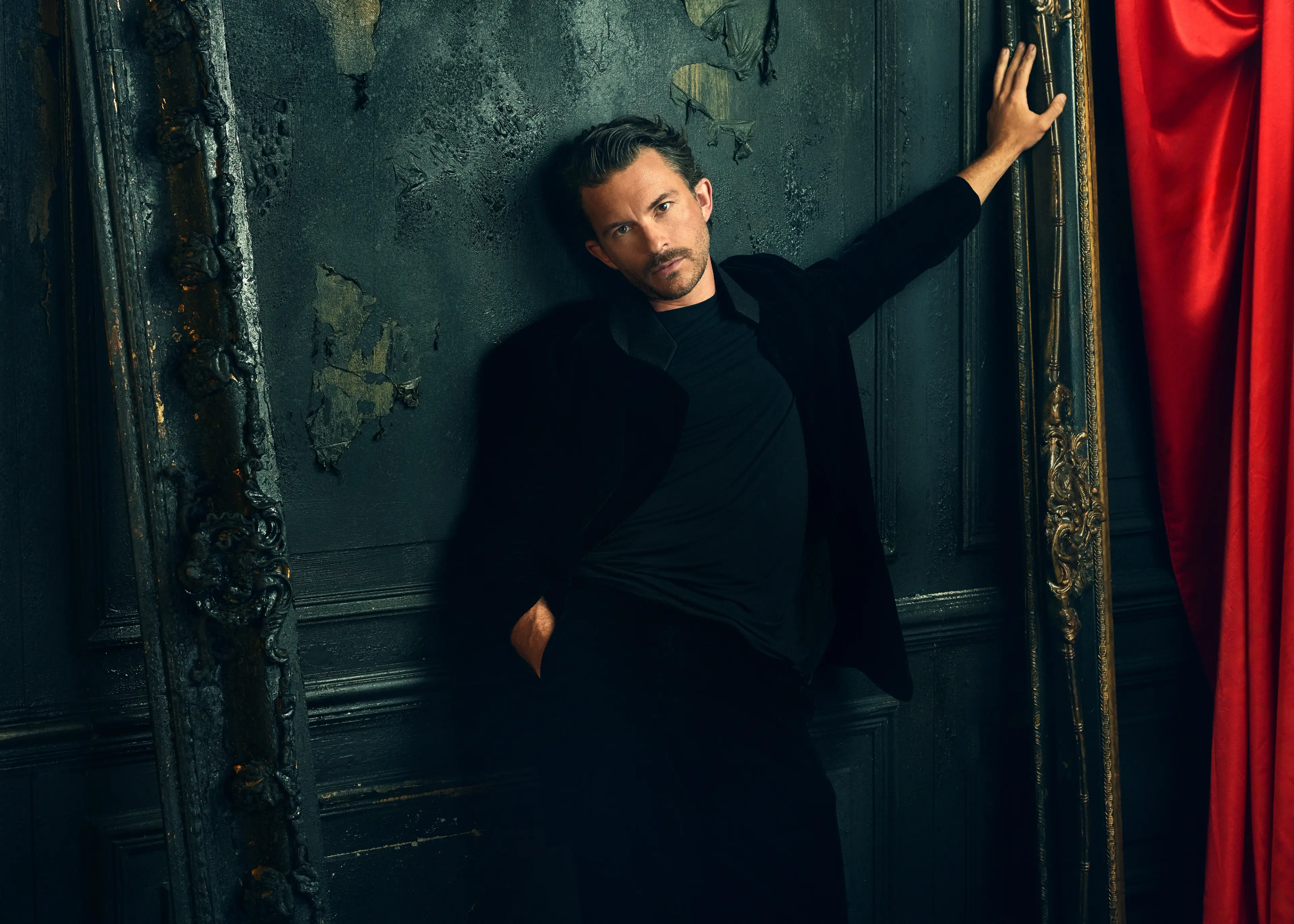 Jonathan Bailey wears a black turtleneck in an official Dracula audio-drama portrait.