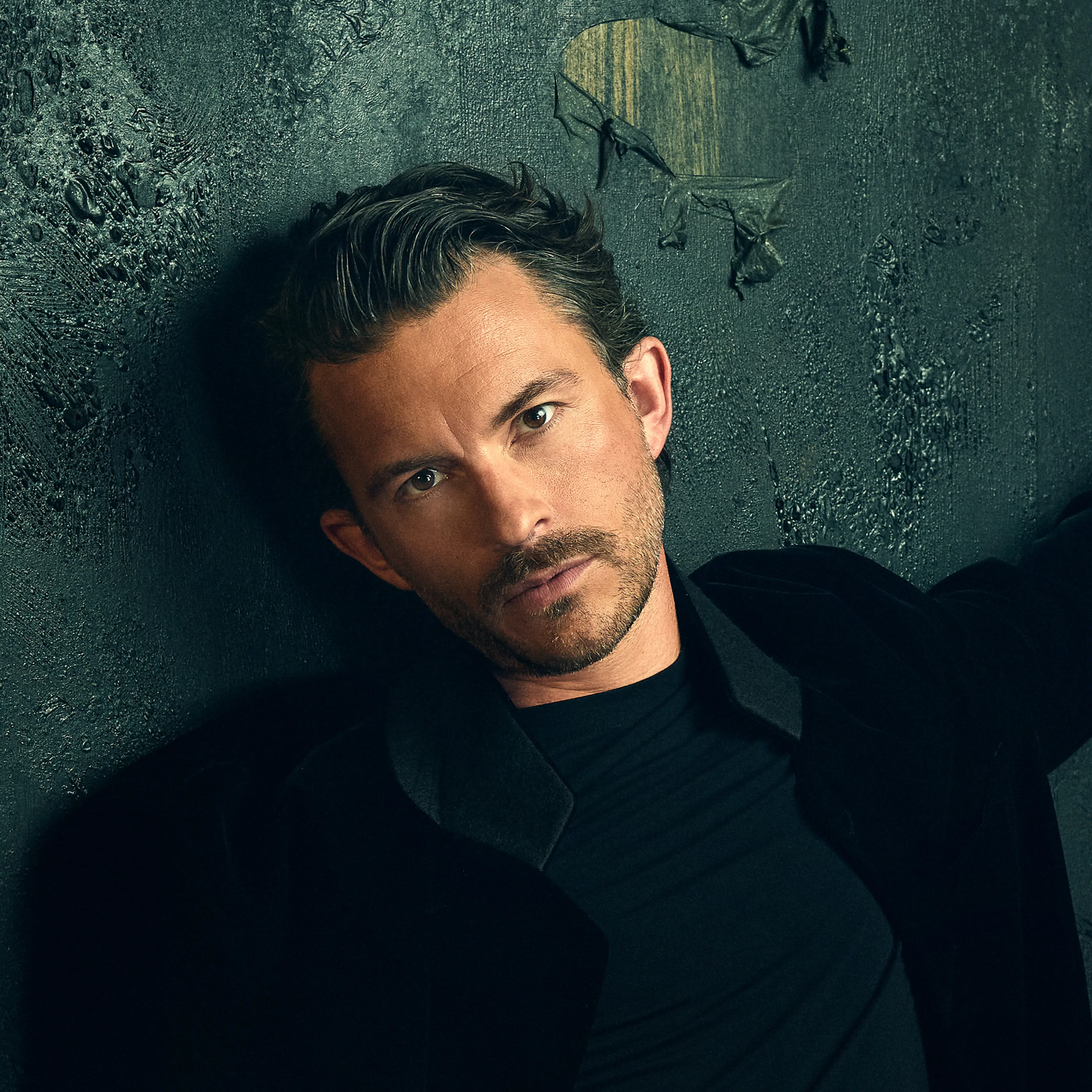 Jonathan Bailey wears a black turtleneck in an official Dracula audio-drama portrait.