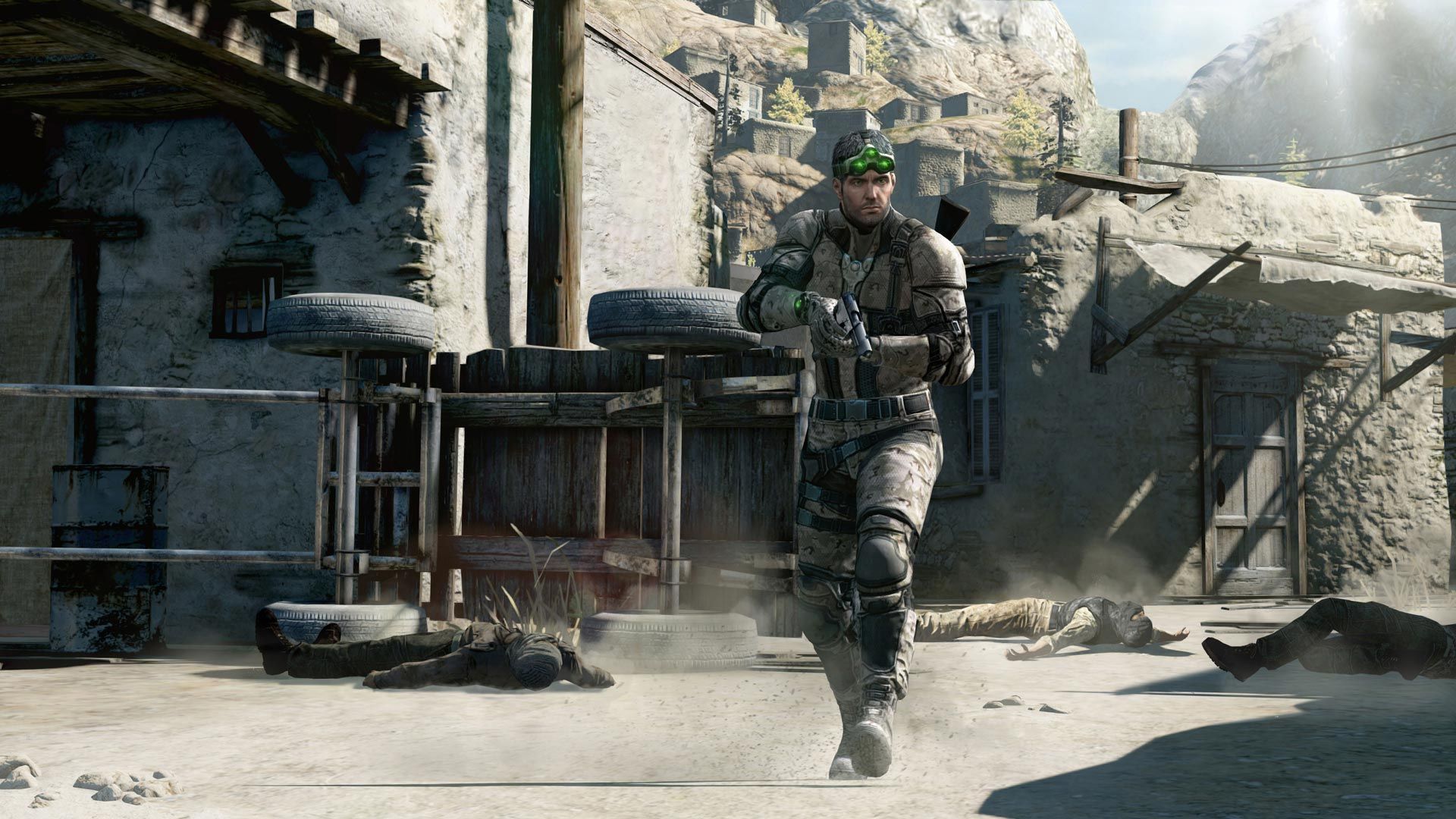 Sam Fisher moves through a damaged outdoor area with a rifle.