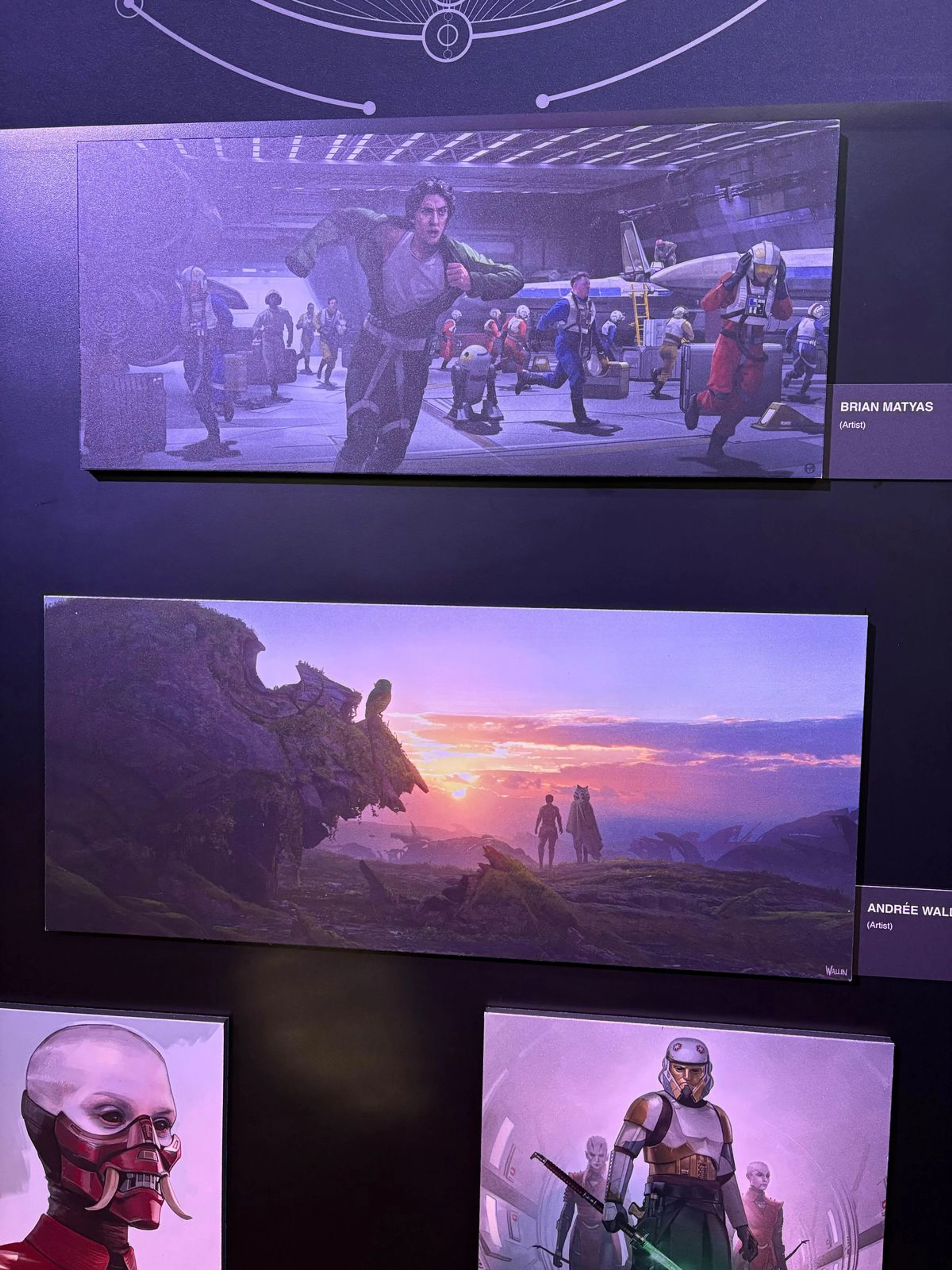 A D23 Ahsoka Season 2 concept-art display shows two figures standing on a rocky world beneath a sunset.