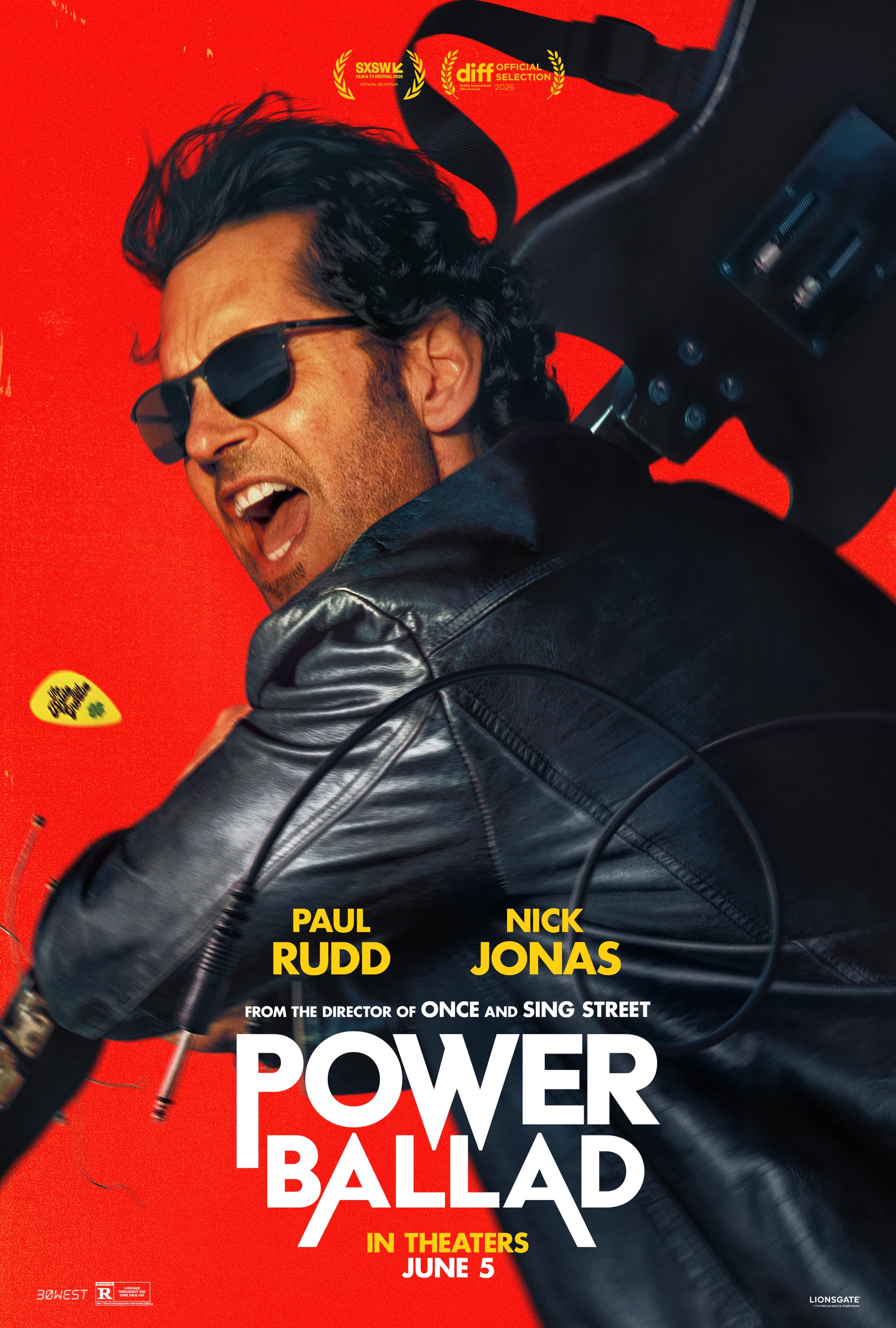Official red Power Ballad poster showing Paul Rudd holding a guitar over his shoulder.