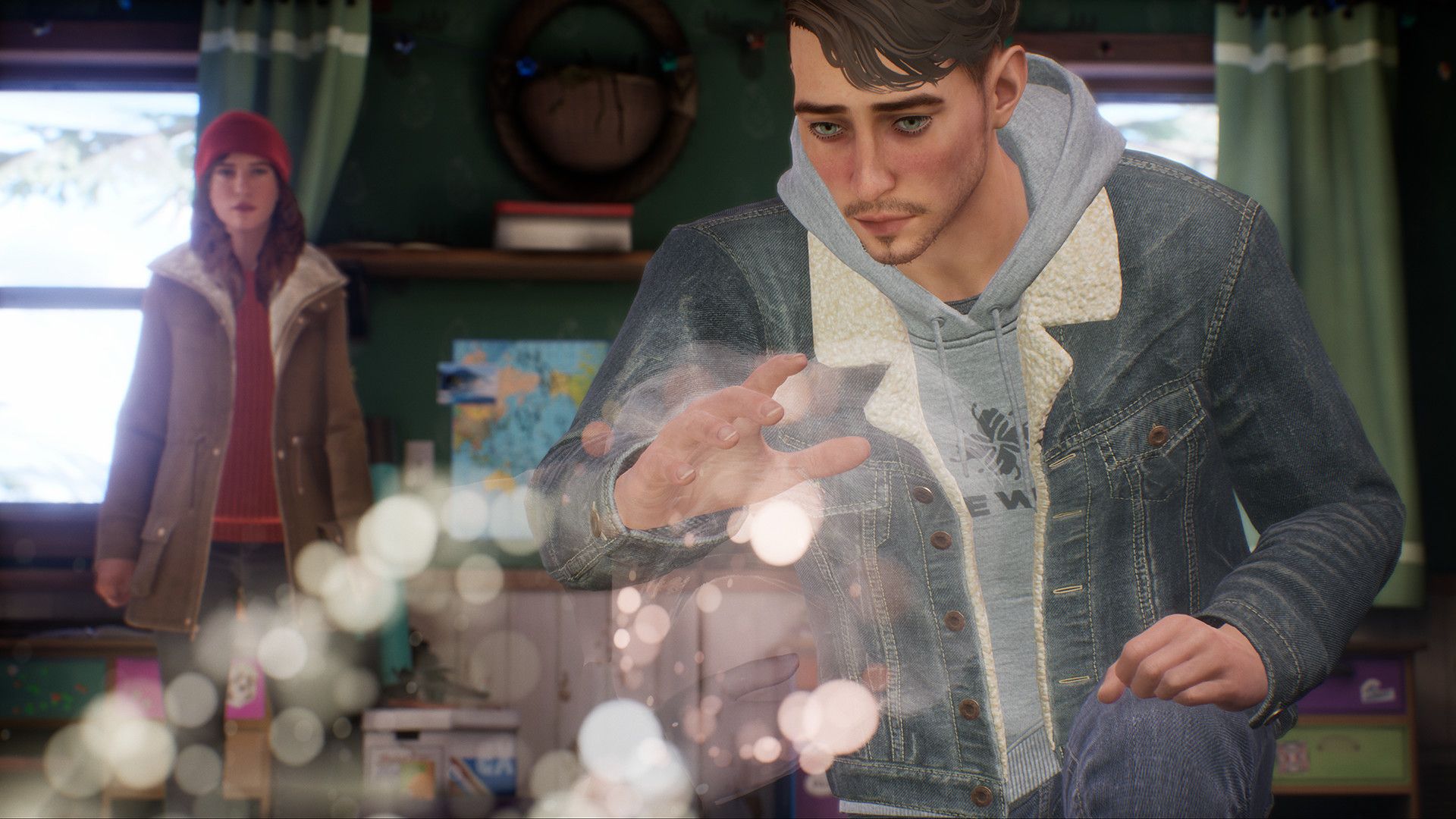 Tyler examines an object while Alyson watches in Tell Me Why.