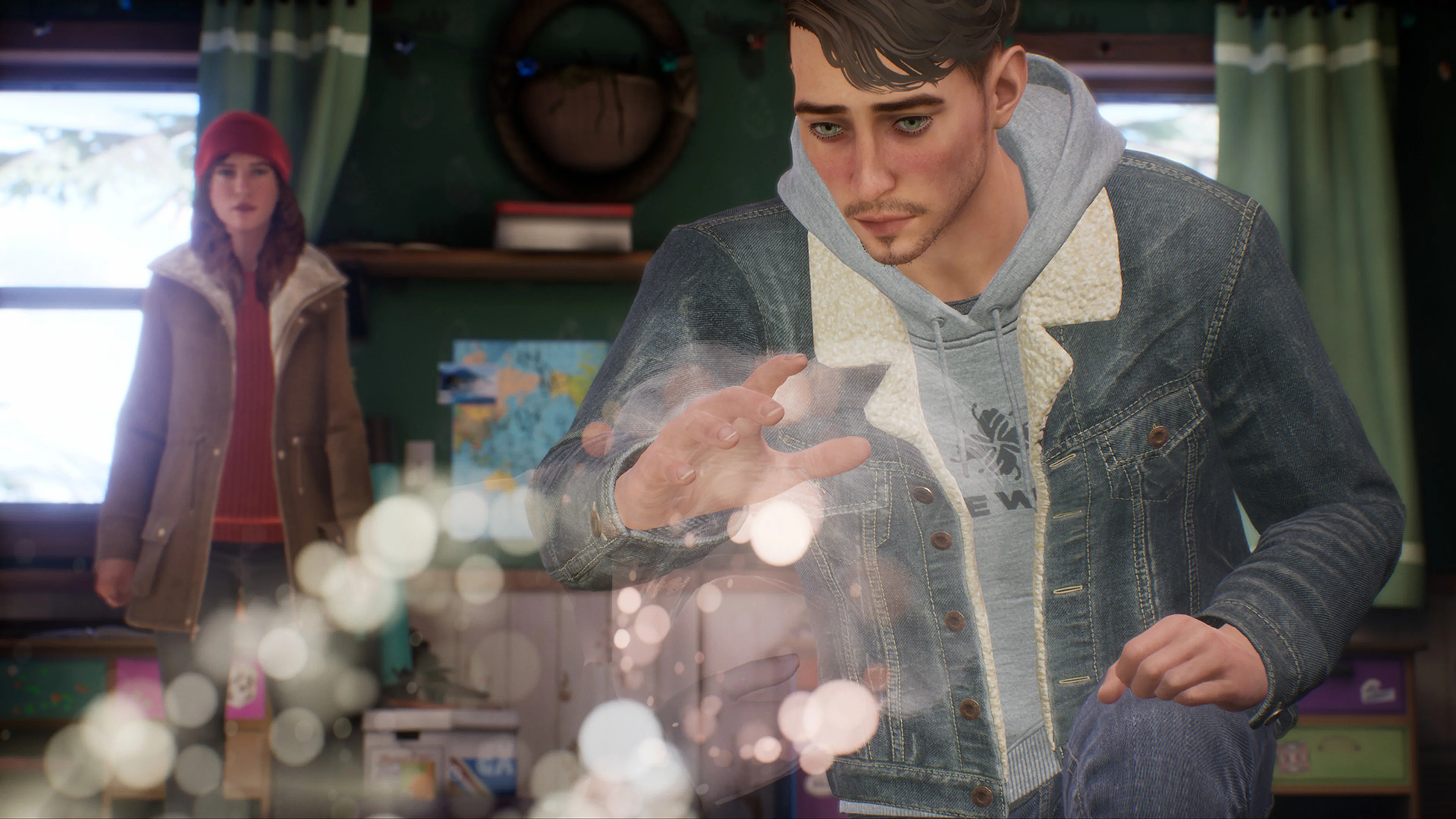 Tyler examines an object while Alyson watches in Tell Me Why.