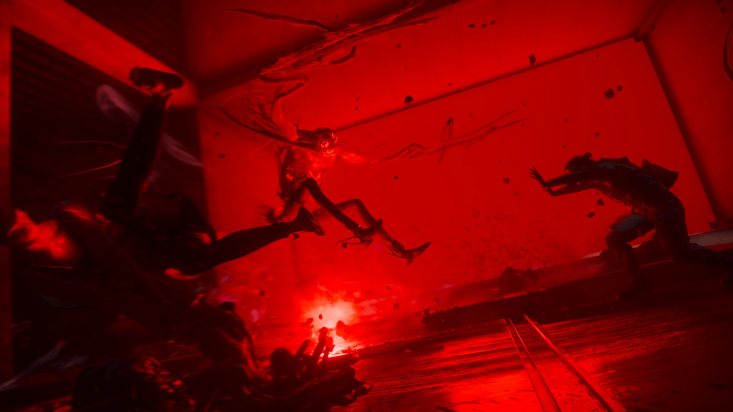 Dylan Faden fights a distorted creature in a red-lit room in CONTROL Resonant.