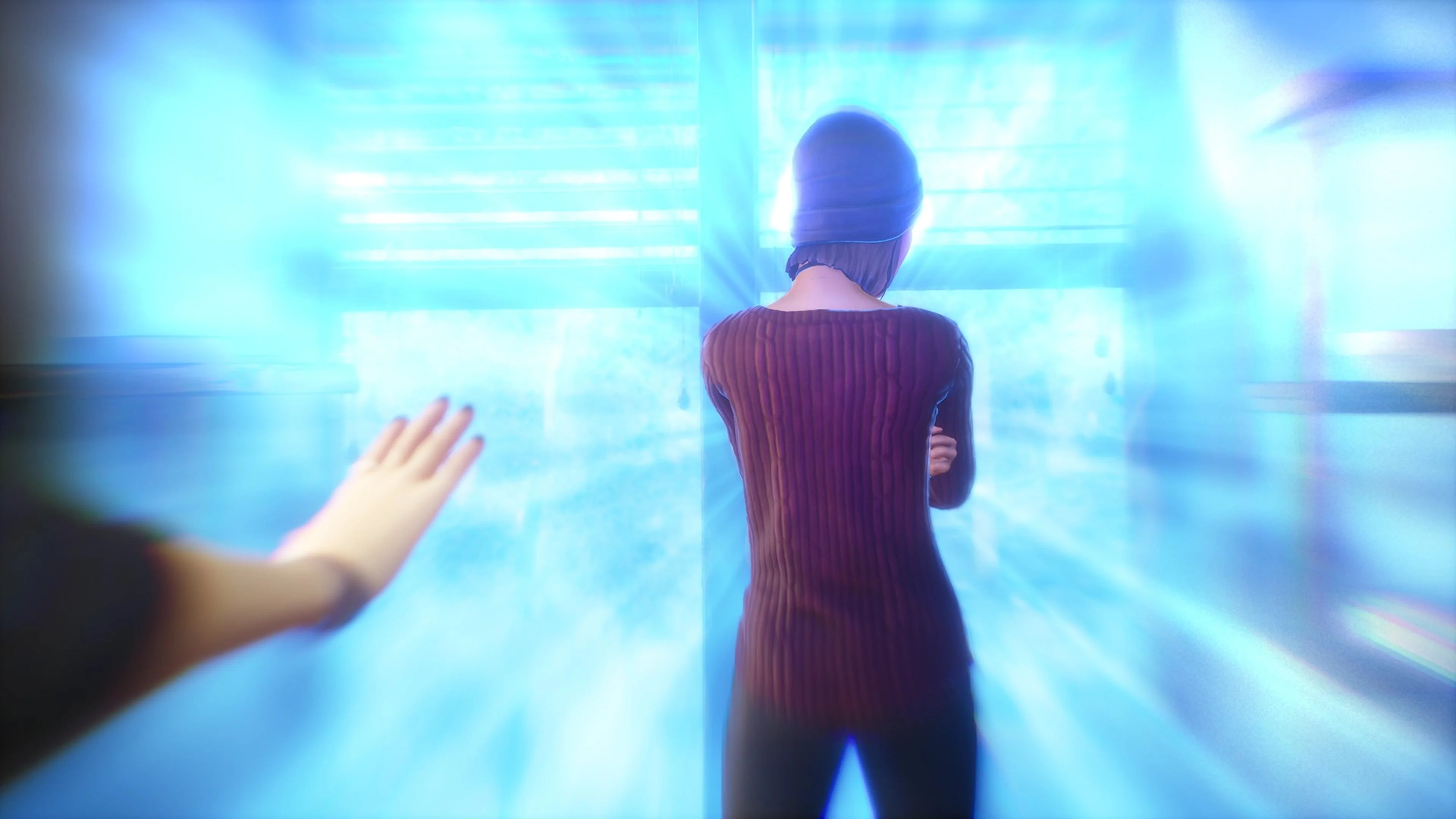 Alex reaches toward a blue emotional aura in Life is Strange: True Colors.