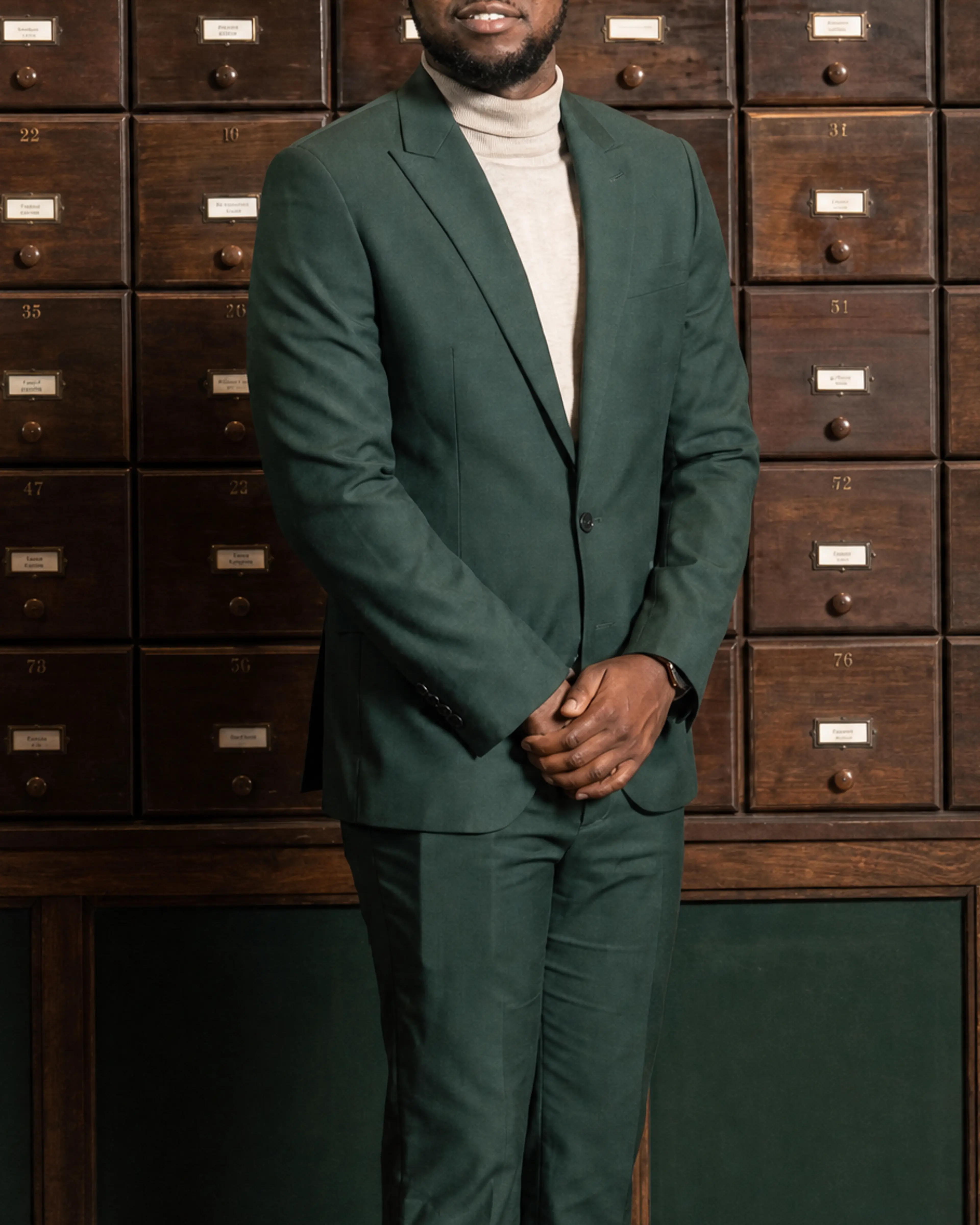 Jonathan, a Chicago Ready to Love contestant, wears a dark green suit in his official cast portrait.
