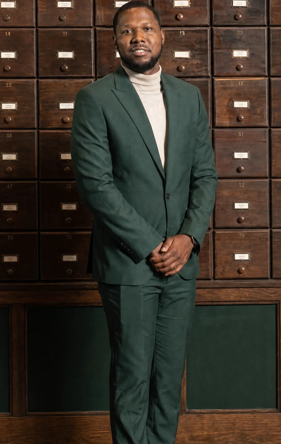 Jonathan, a Chicago Ready to Love contestant, wears a dark green suit in his official cast portrait.