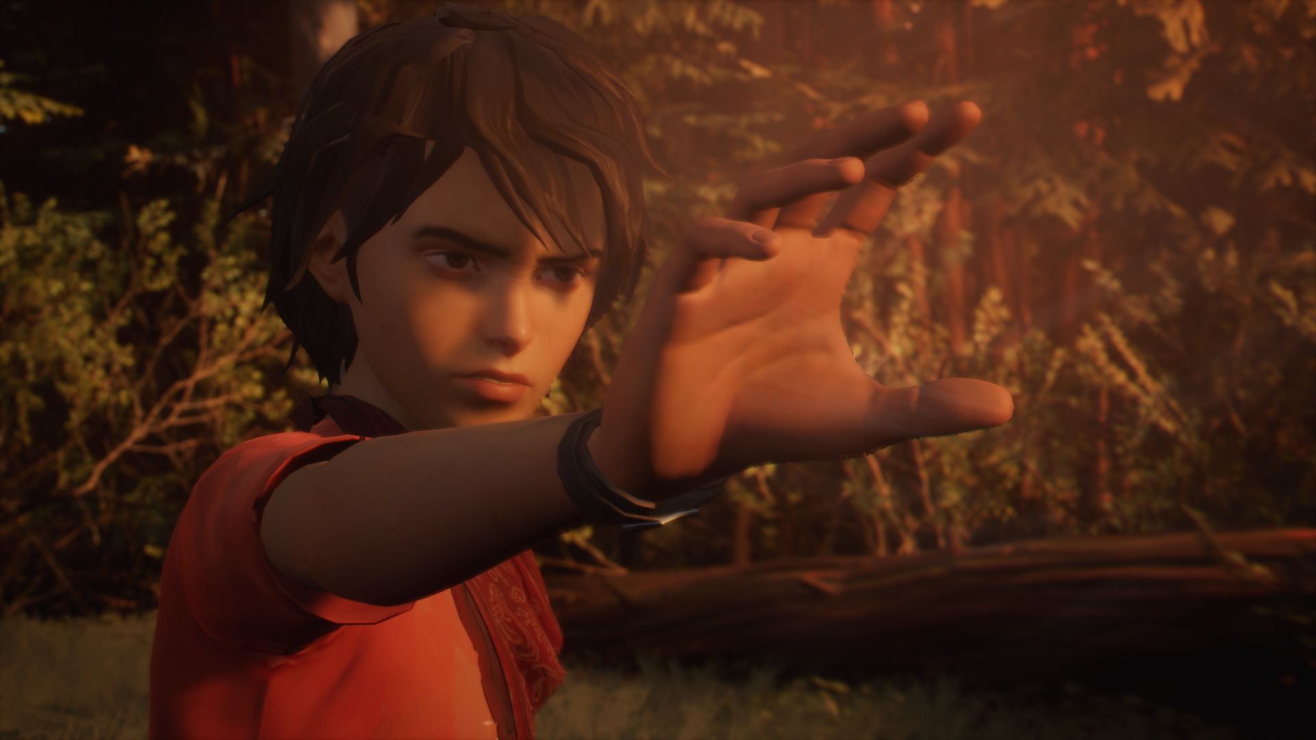 Daniel Diaz raises his hand in a forest in Life is Strange 2.