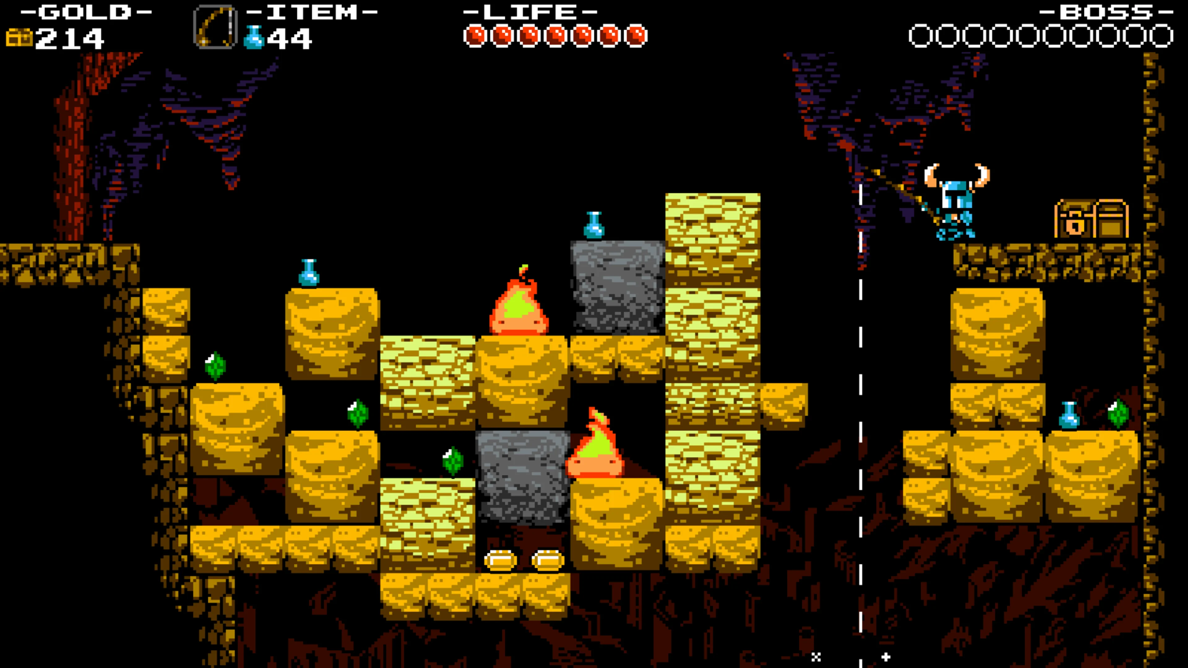 Official underground screenshot with Shovel Knight at right, yellow patterned blocks in the middle, green gems, blue magic flasks, two fire enemies and a chest across a gap.