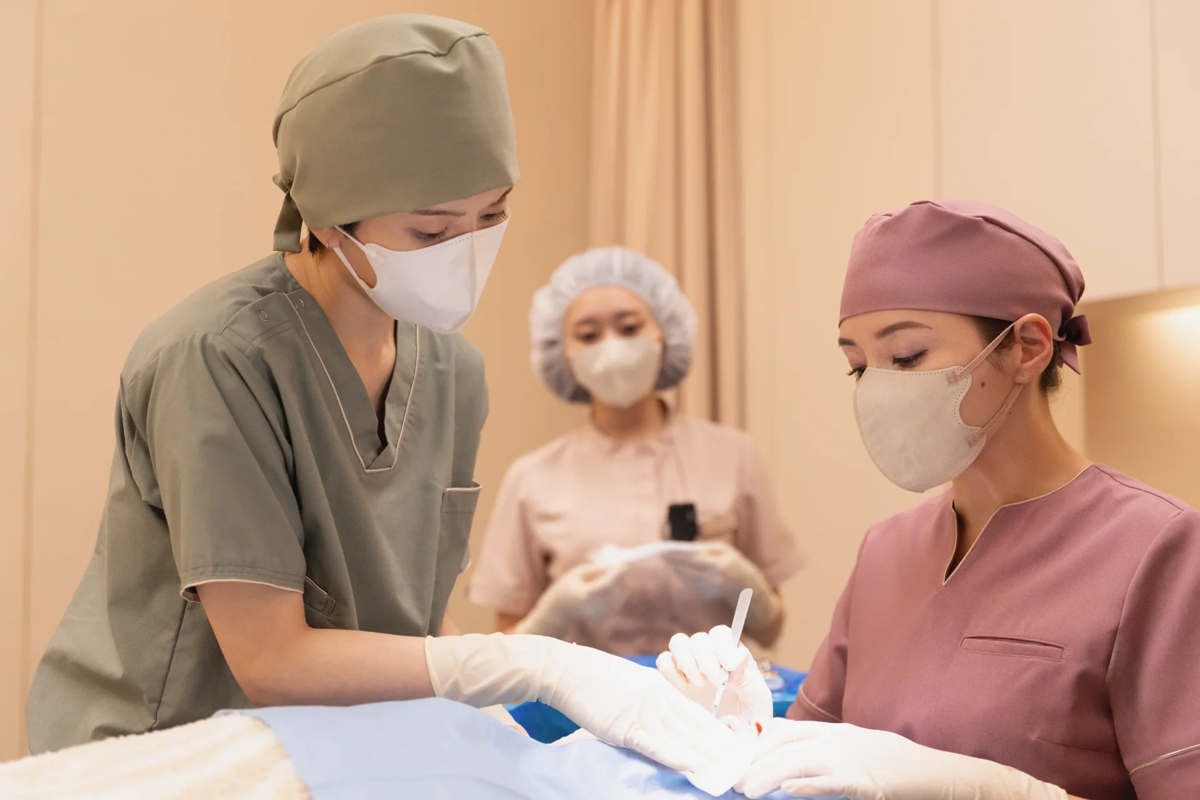 Masked doctors and staff work together in an operating room in Plastic Beauty.