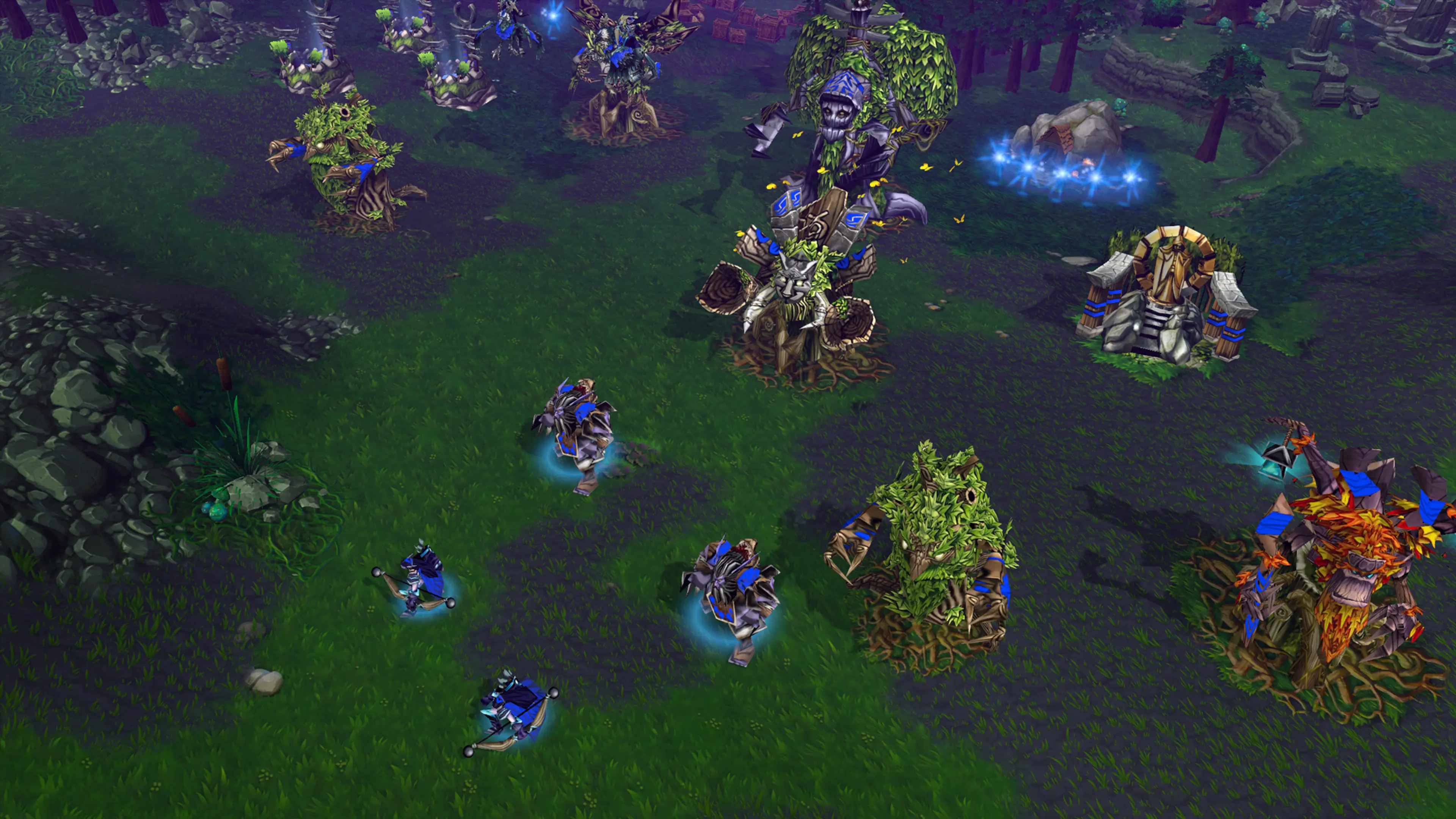 Night Elf units and buildings fill a forest settlement in Warcraft III: Reforged.