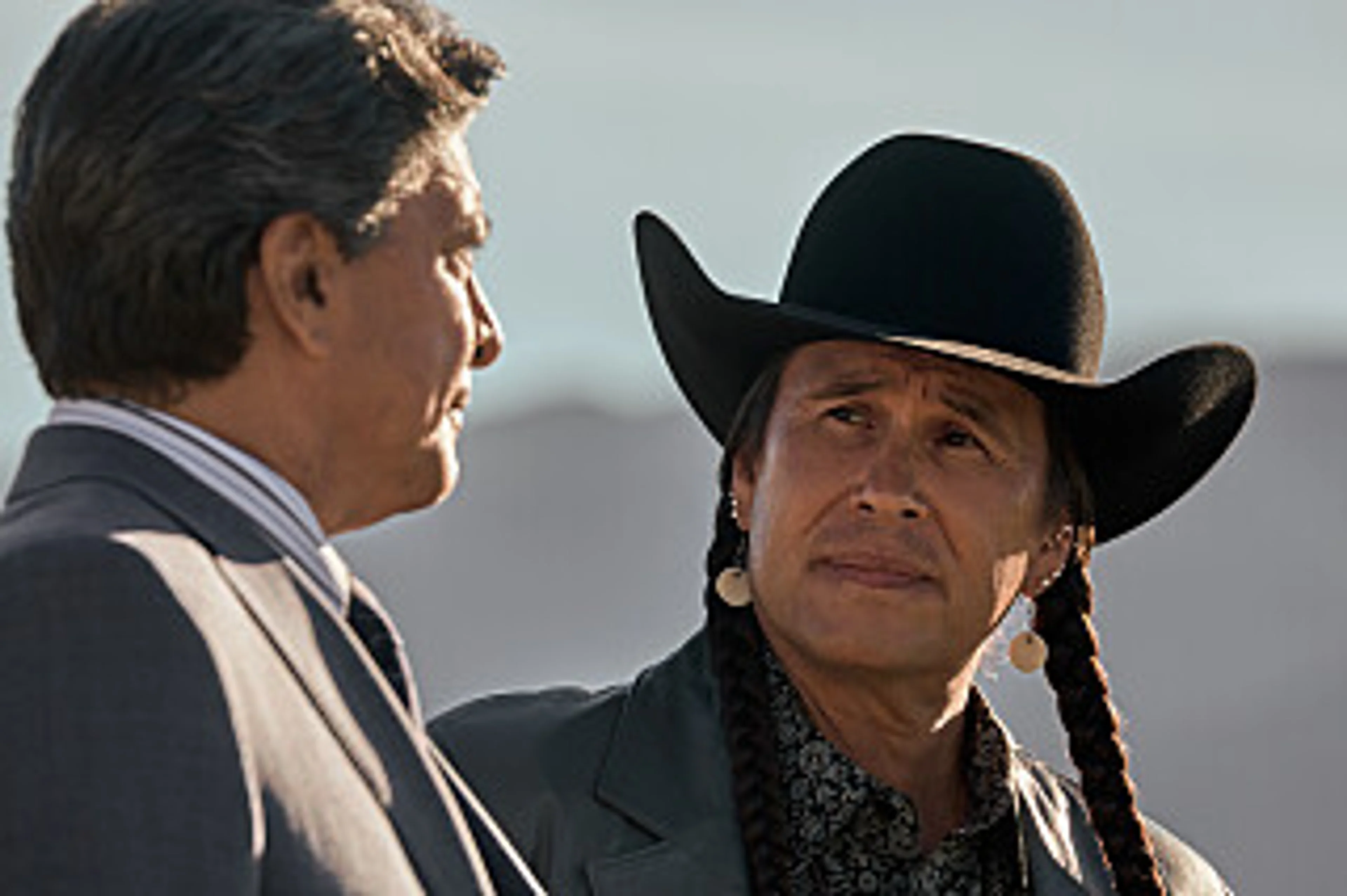 Gil Birmingham as Thomas Rainwater speaks with another character in an official Yellowstone episode still.