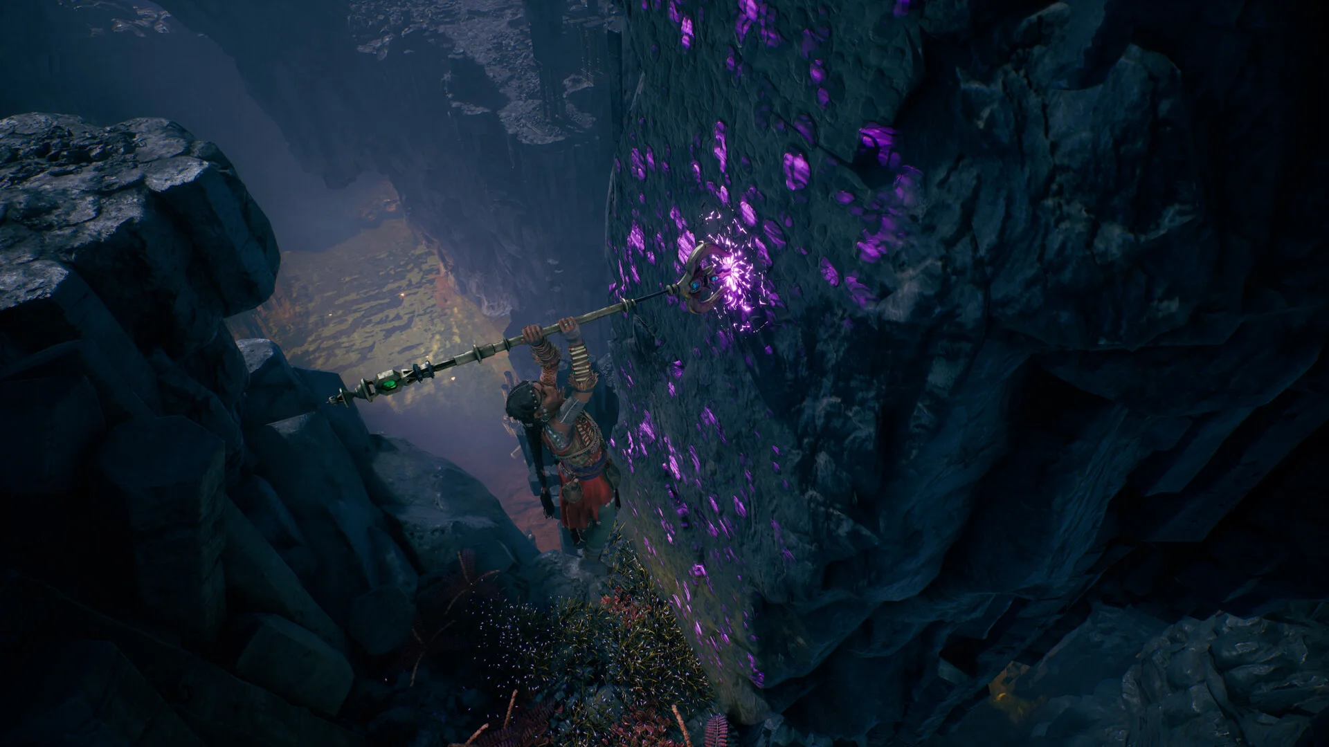 Raji uses a long weapon to move beside a wall with glowing purple markings.