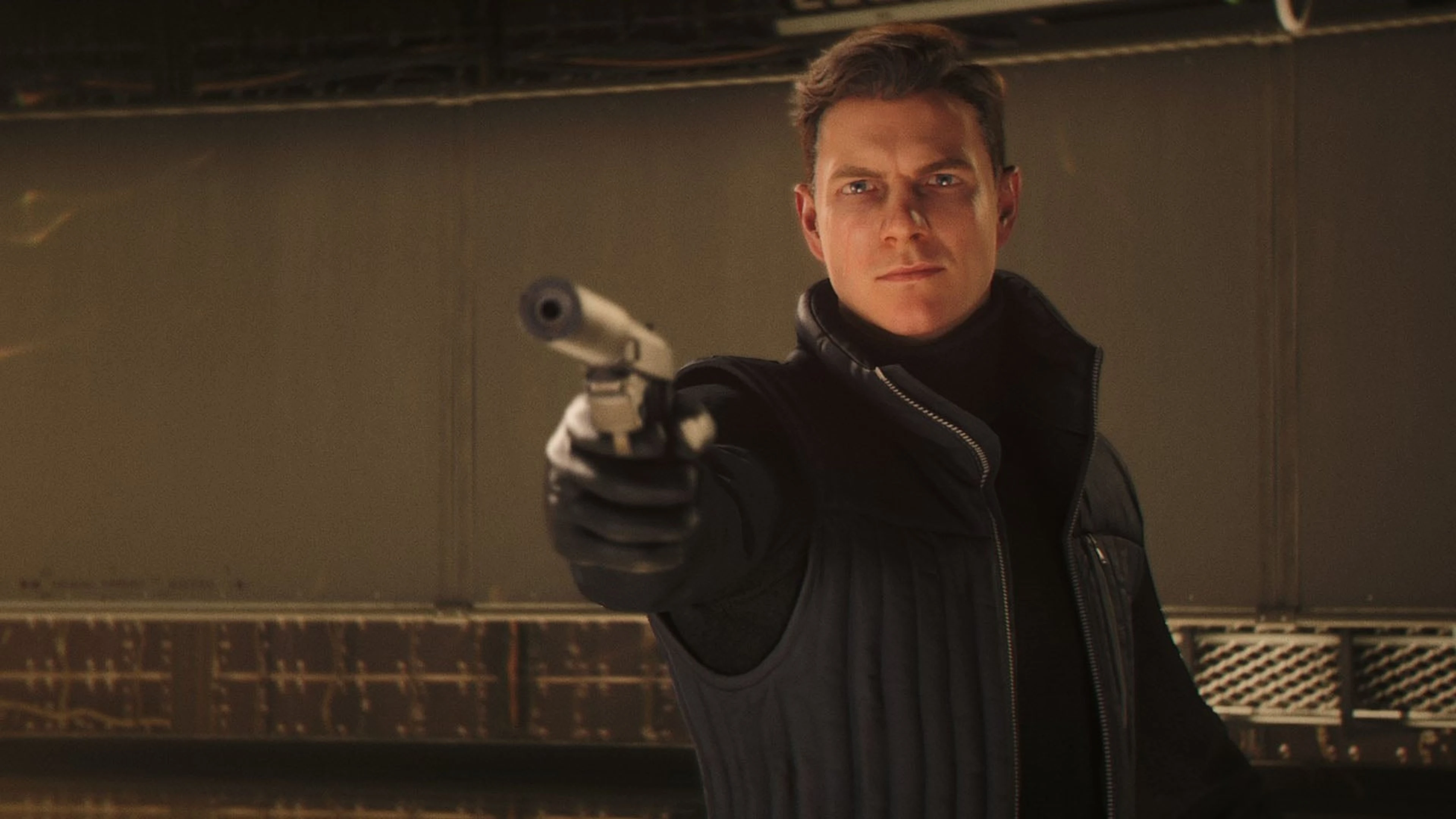 James Bond aims a suppressed pistol in 007 First Light.