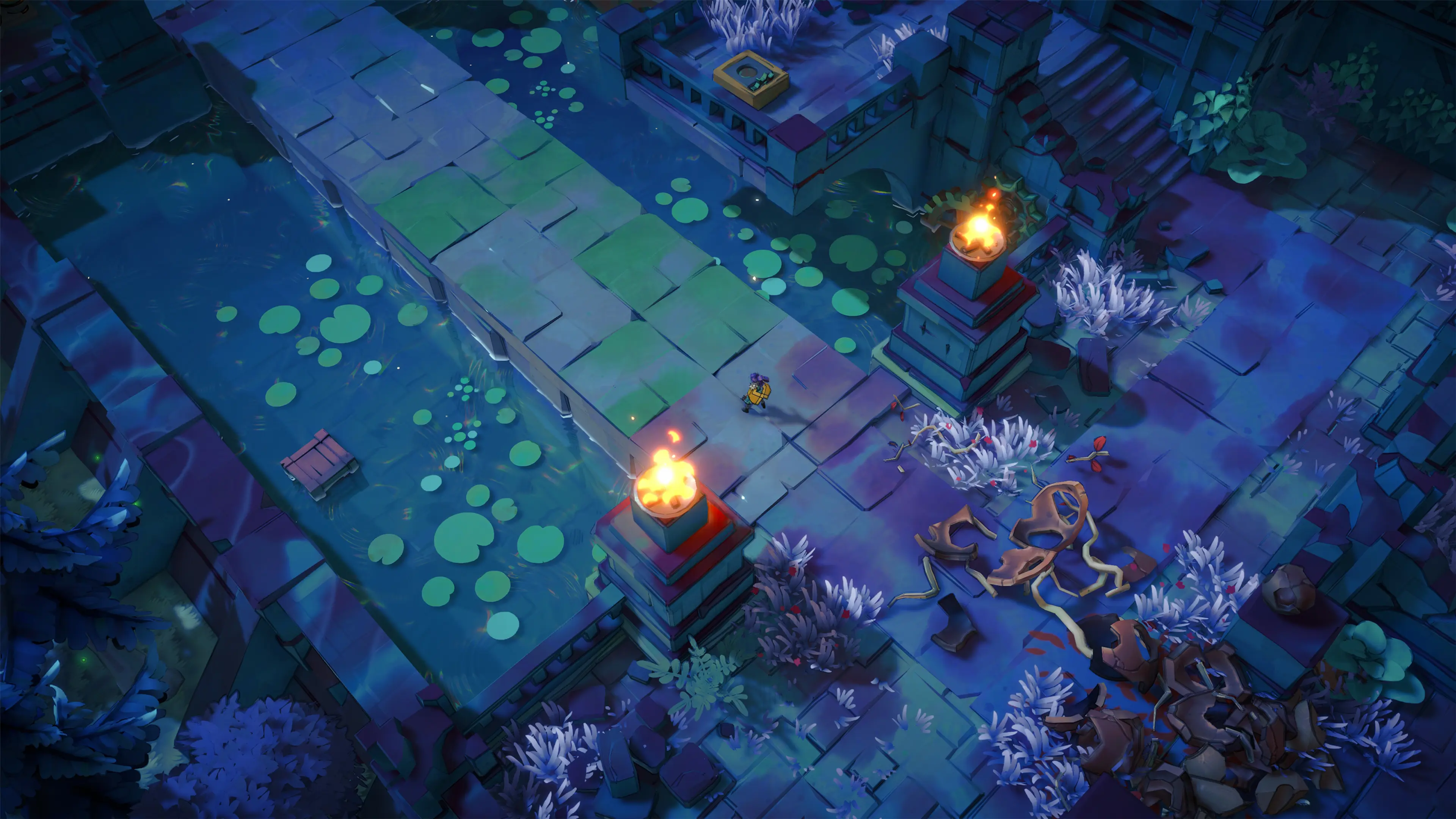 Sonia crosses blue-lit ruins between fire-topped pillars in Uncanyon.