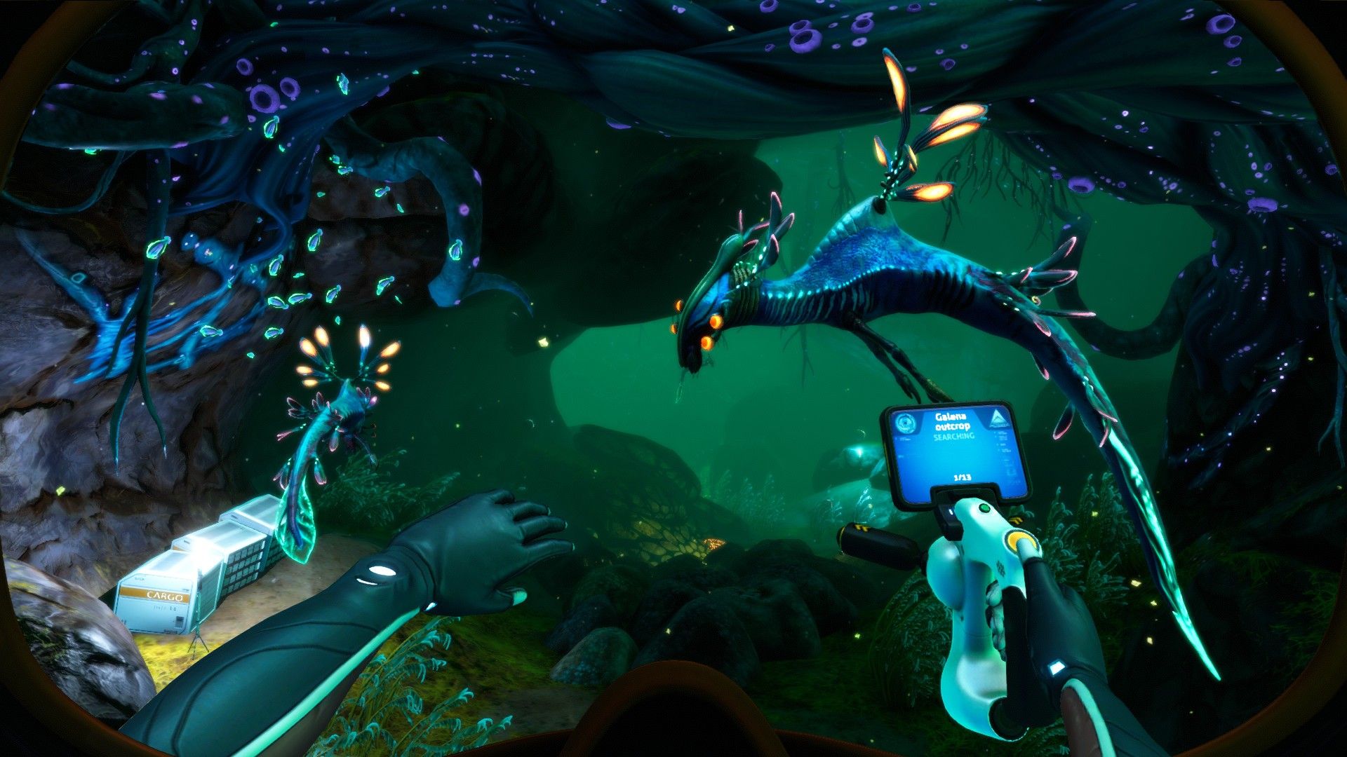 Robin swims near luminous sea life and a small underwater craft in Below Zero.