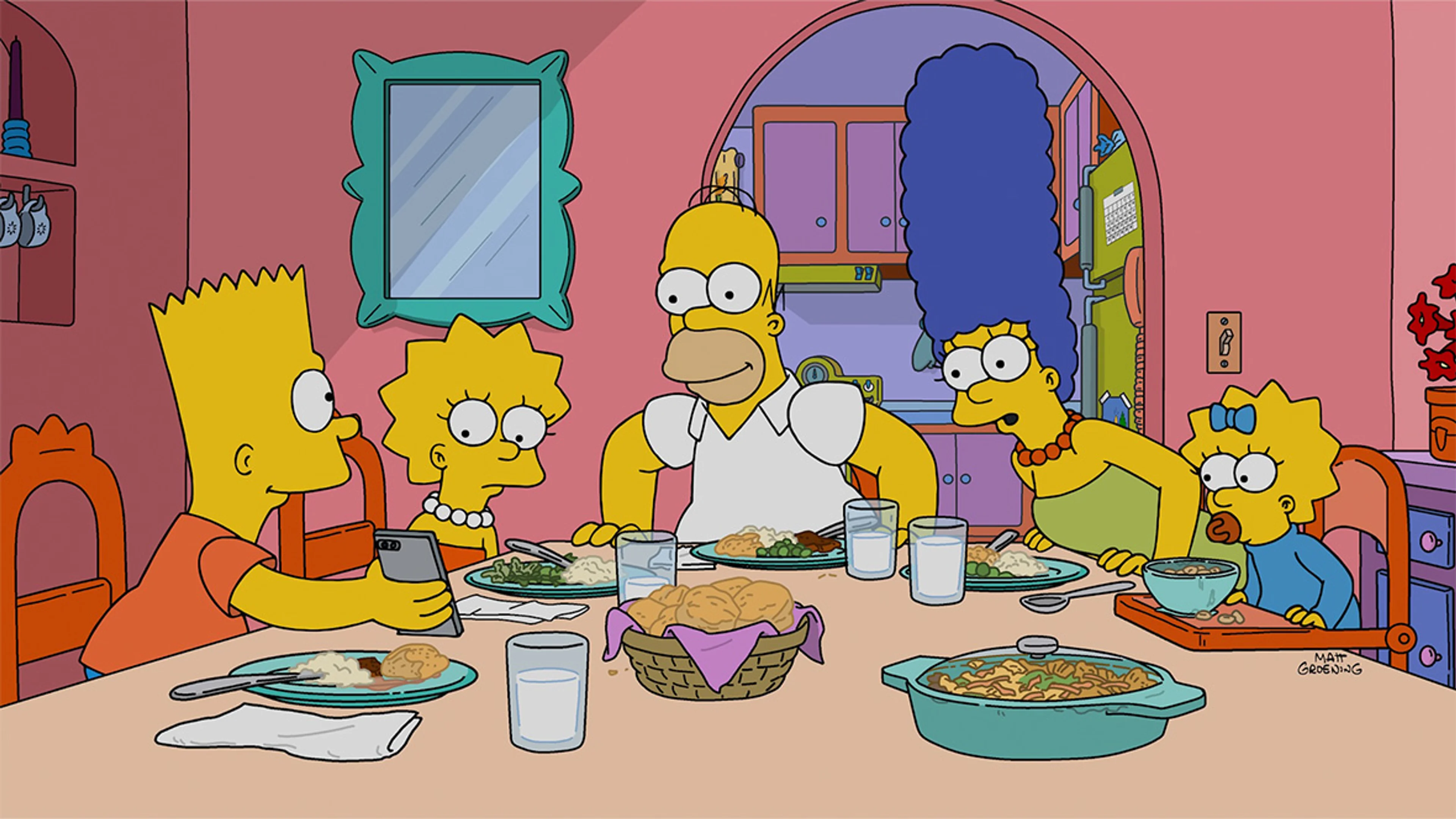 Homer, Marge, Bart, Lisa, and Maggie sitting around the kitchen table in an official Simpsons image.