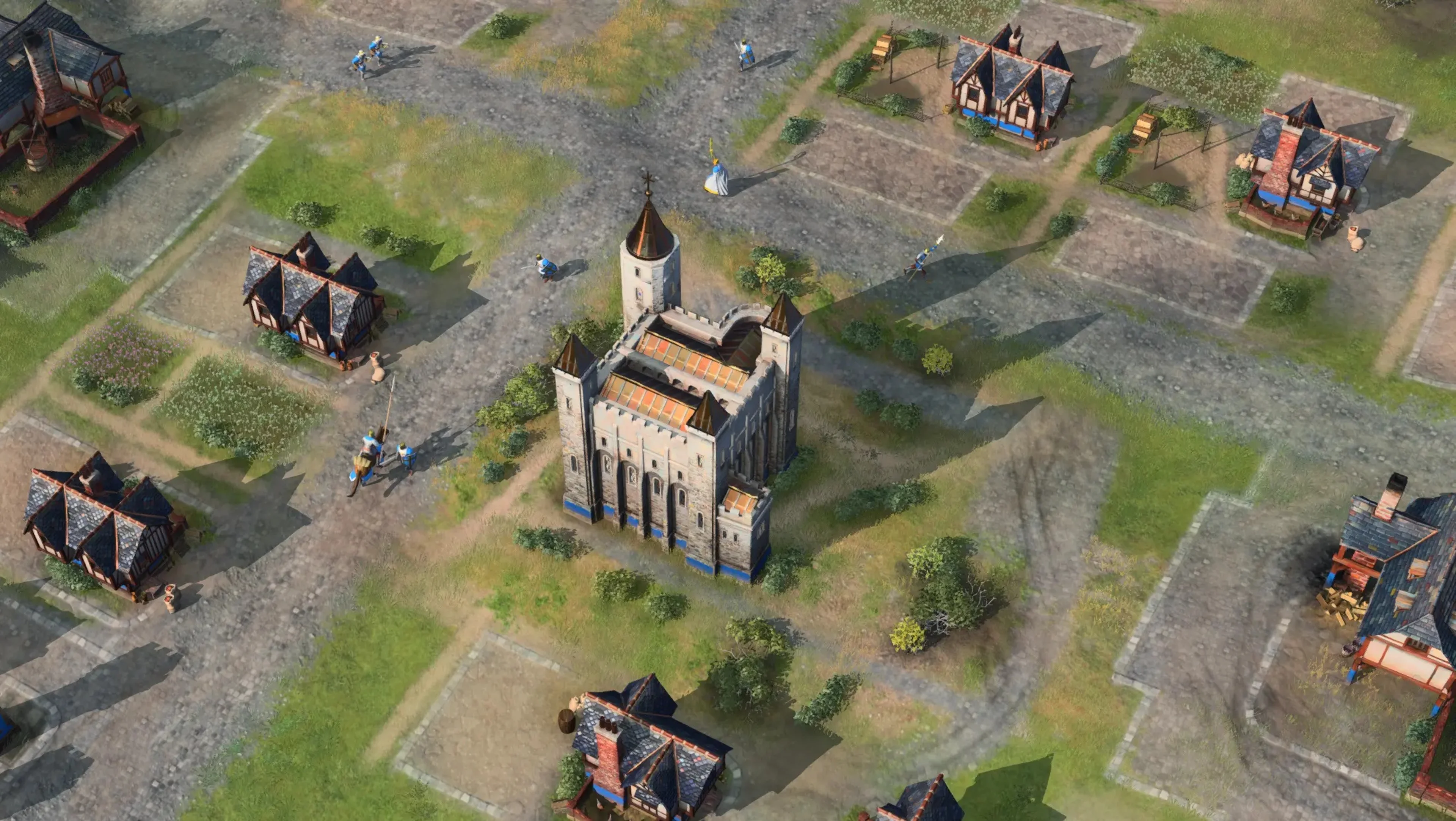 The White Tower is the square stone fortress in the center. It is an English Castle Age landmark with a defensive role, unlike Council Hall’s earlier ranged-unit opening.