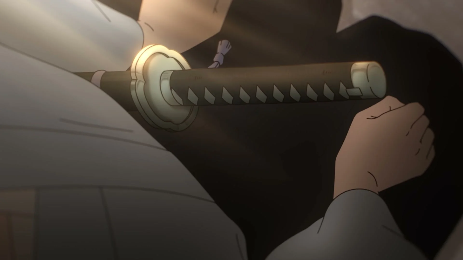 A hand grips a sword in Inherit the Winds.