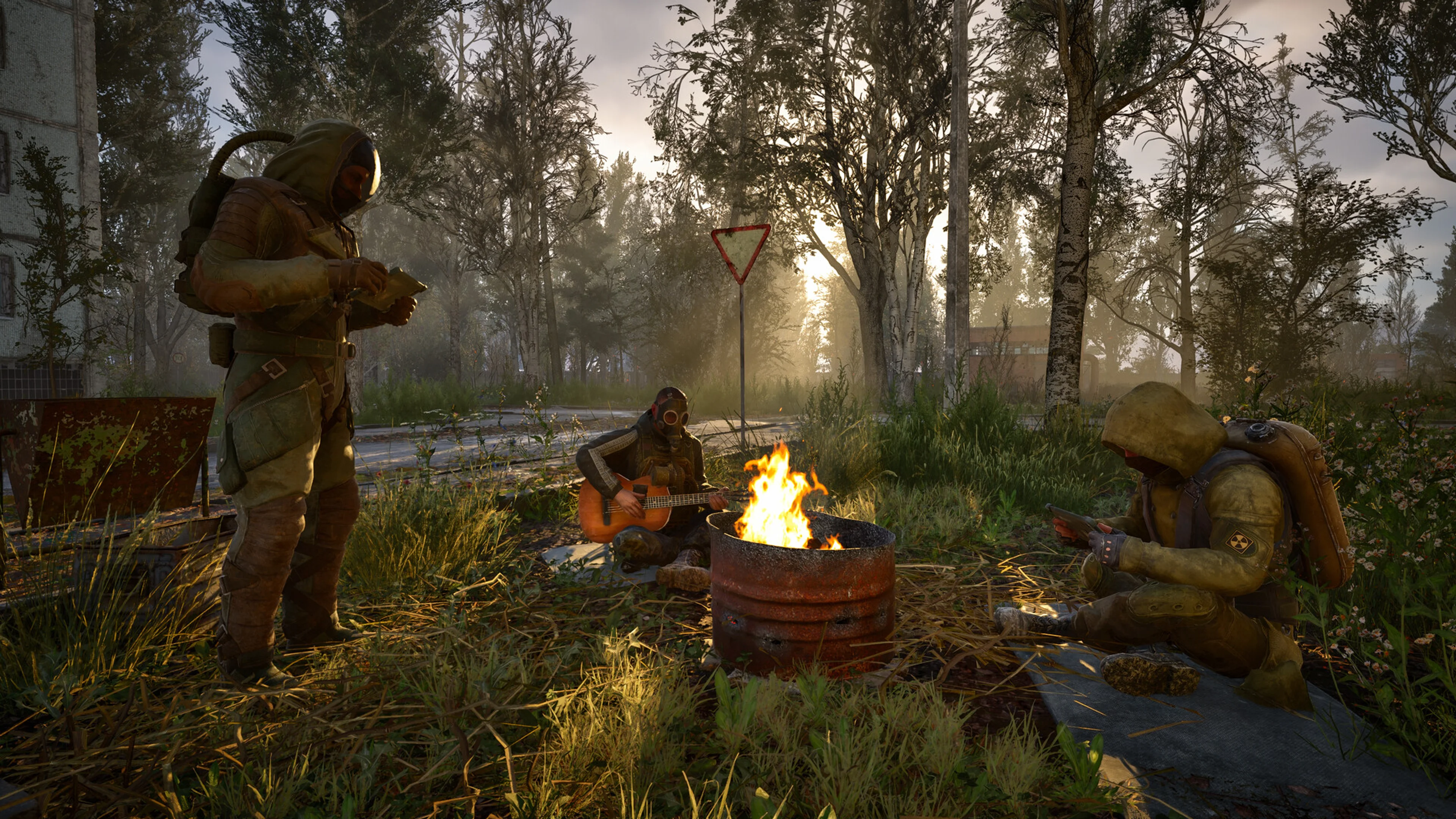 Three stalkers resting around a campfire in S.T.A.L.K.E.R. 2.