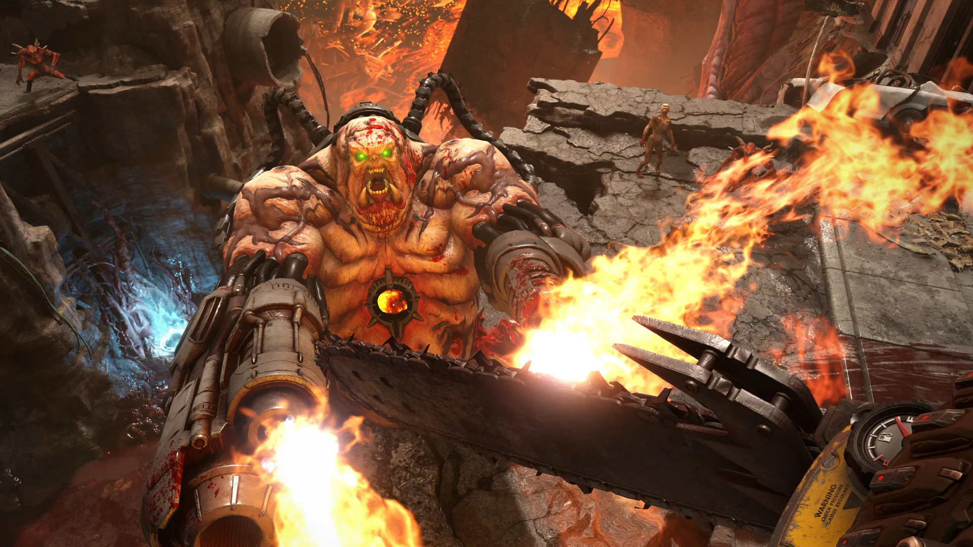 Large Mancubus with arm cannons and a stream of fire stands in front of several smaller zombies.