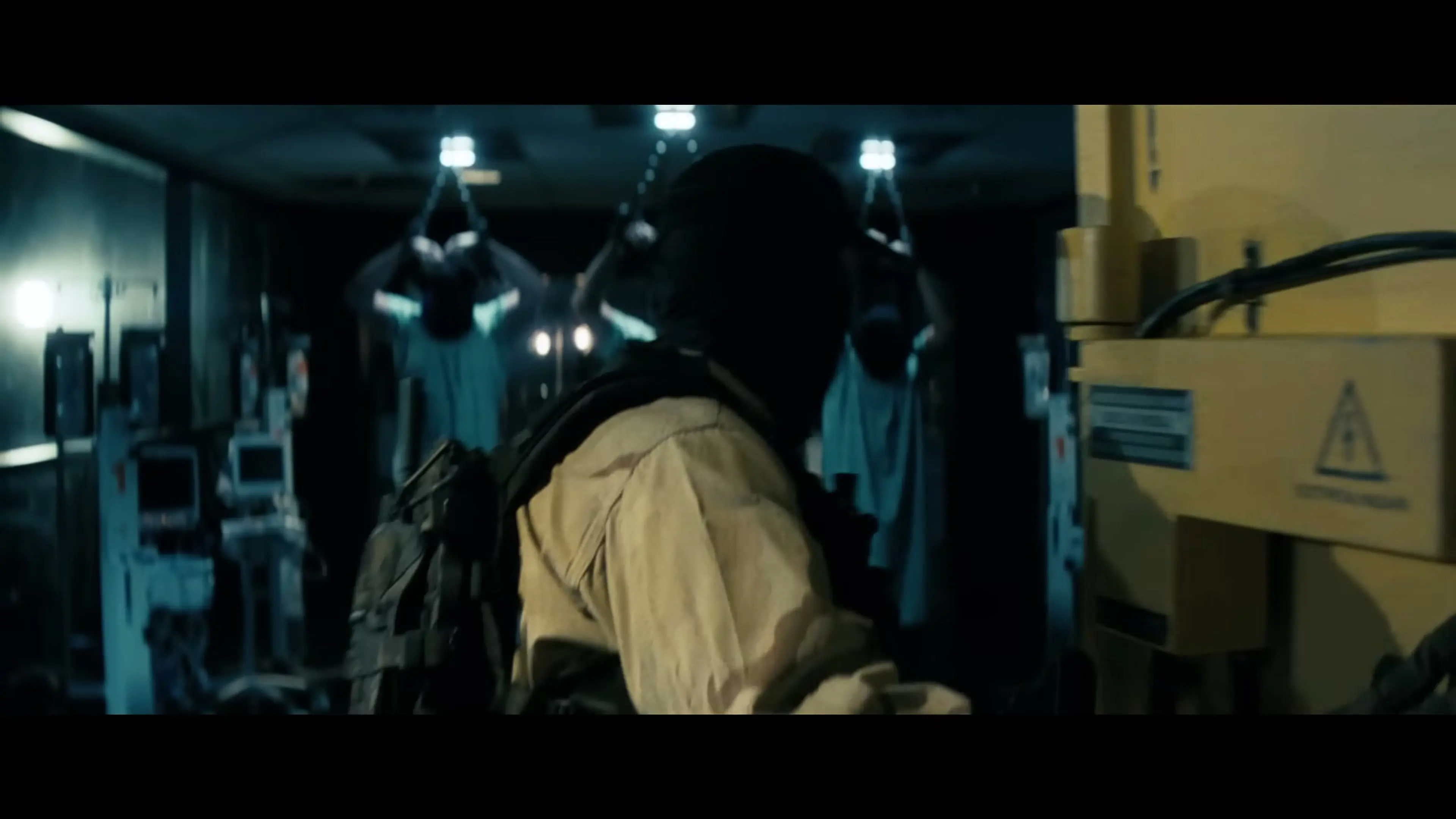Armed personnel enter a desert research facility in Onslaught.