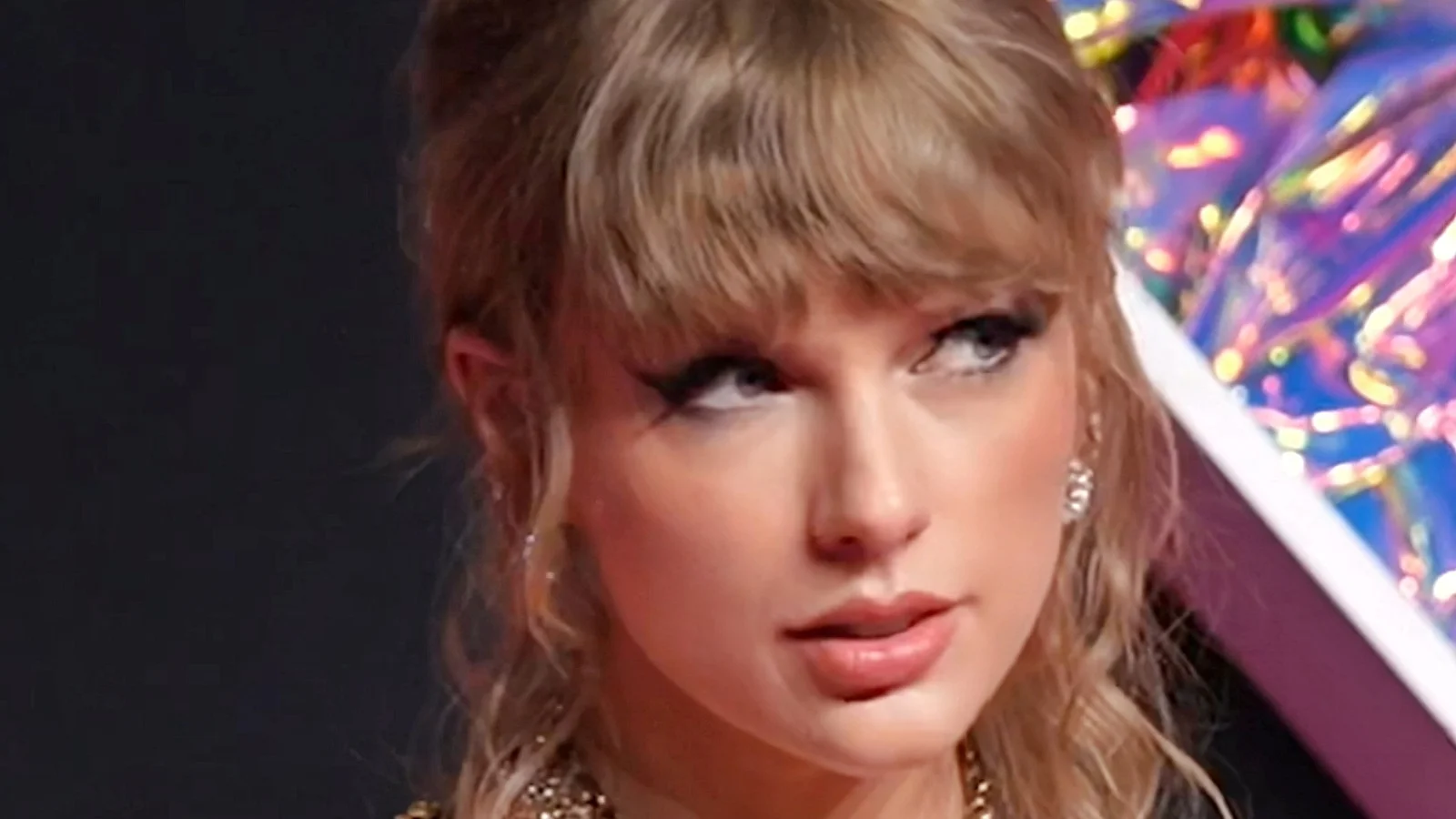 Taylor Swift looks toward the stage at the 2023 MTV Video Music Awards.