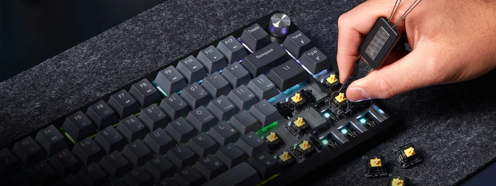 Switch puller removing a switch from the K65 Plus Wireless