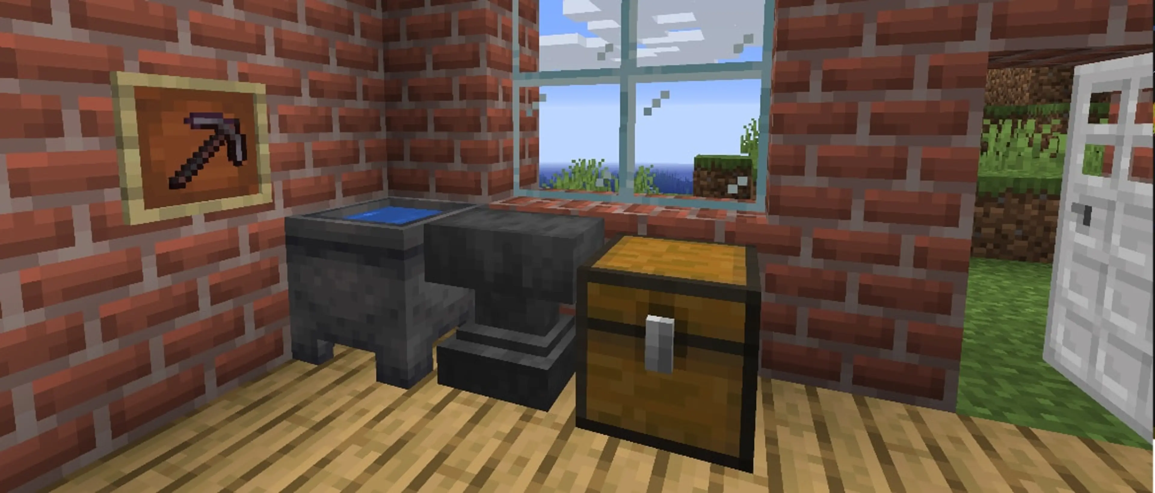 A Minecraft anvil beside a chest and a framed enchanted pickaxe.