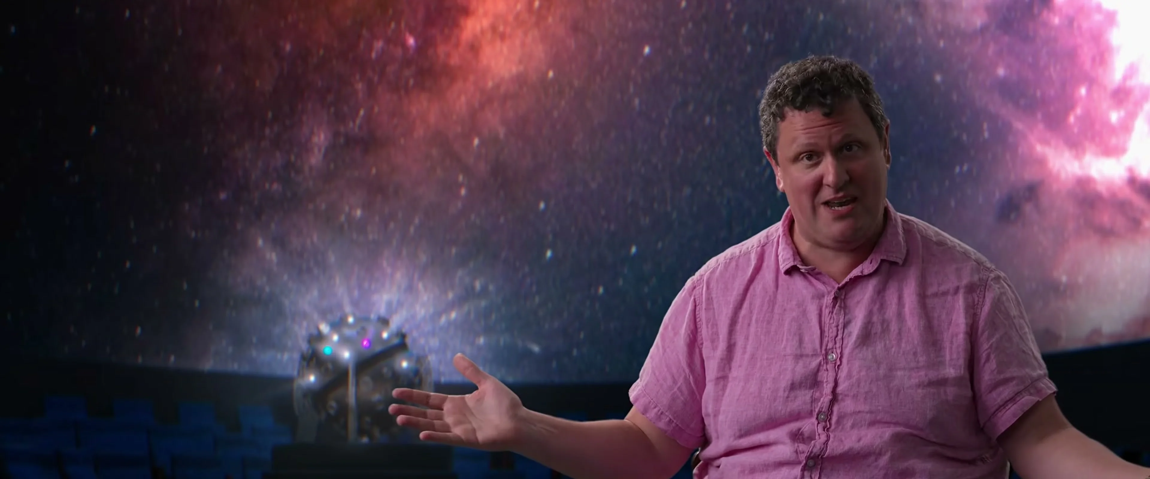 An interview subject in a pink shirt speaks in the official Musk documentary trailer.