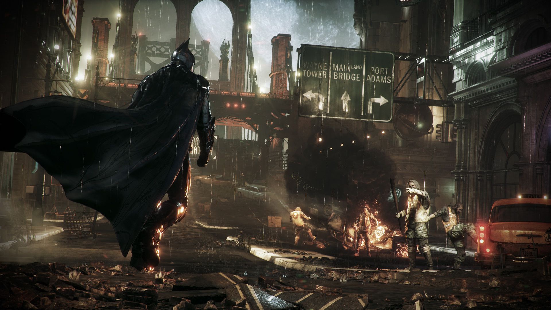 Batman glides toward enemies across a dark Gotham street.