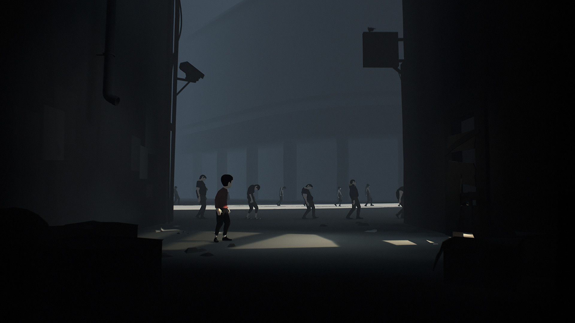Figures stand in a large dark room while the boy watches nearby.