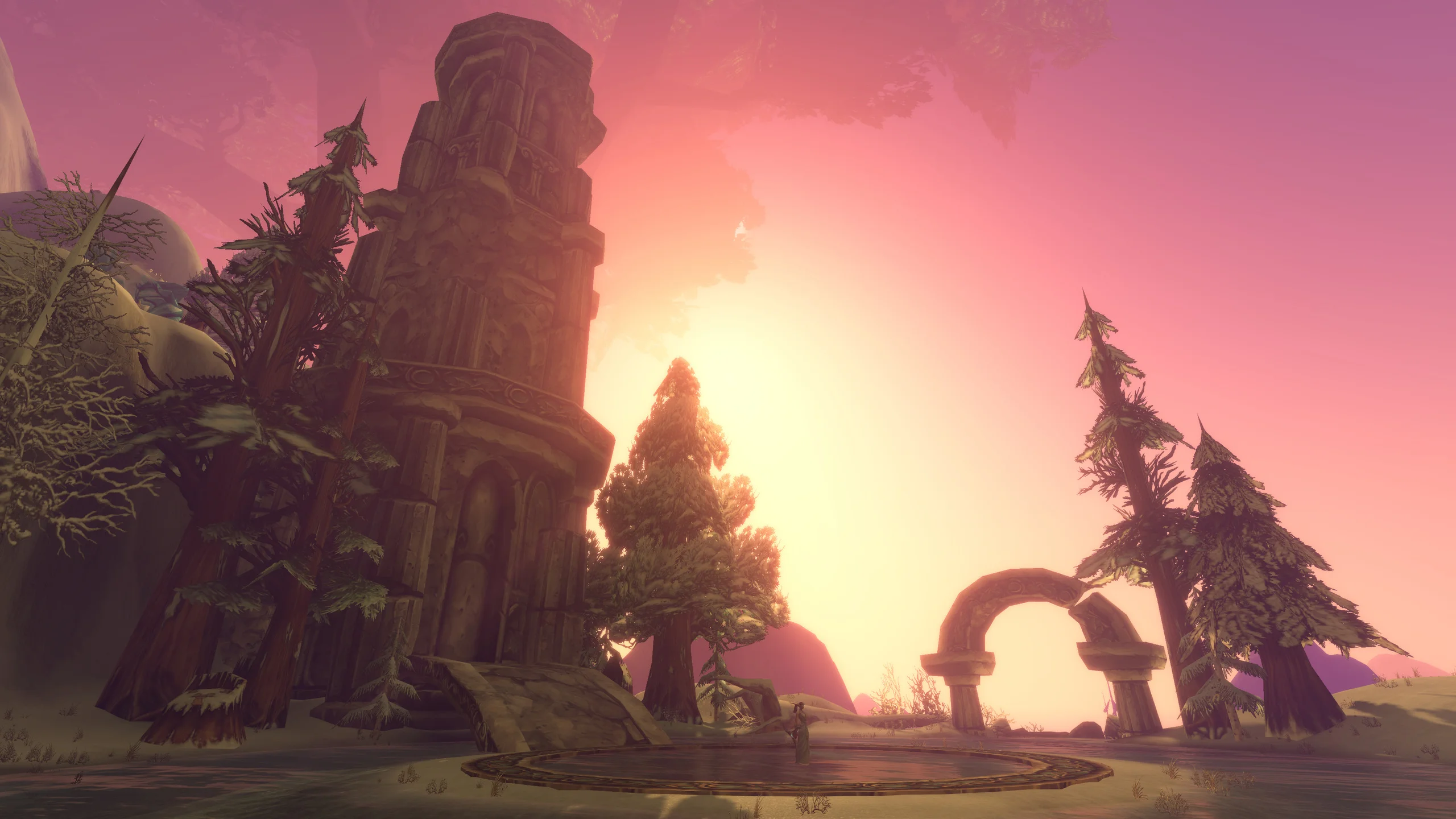 Ruined stone towers and trees stand beneath a red sunset in the Mount Hyjal raid area.