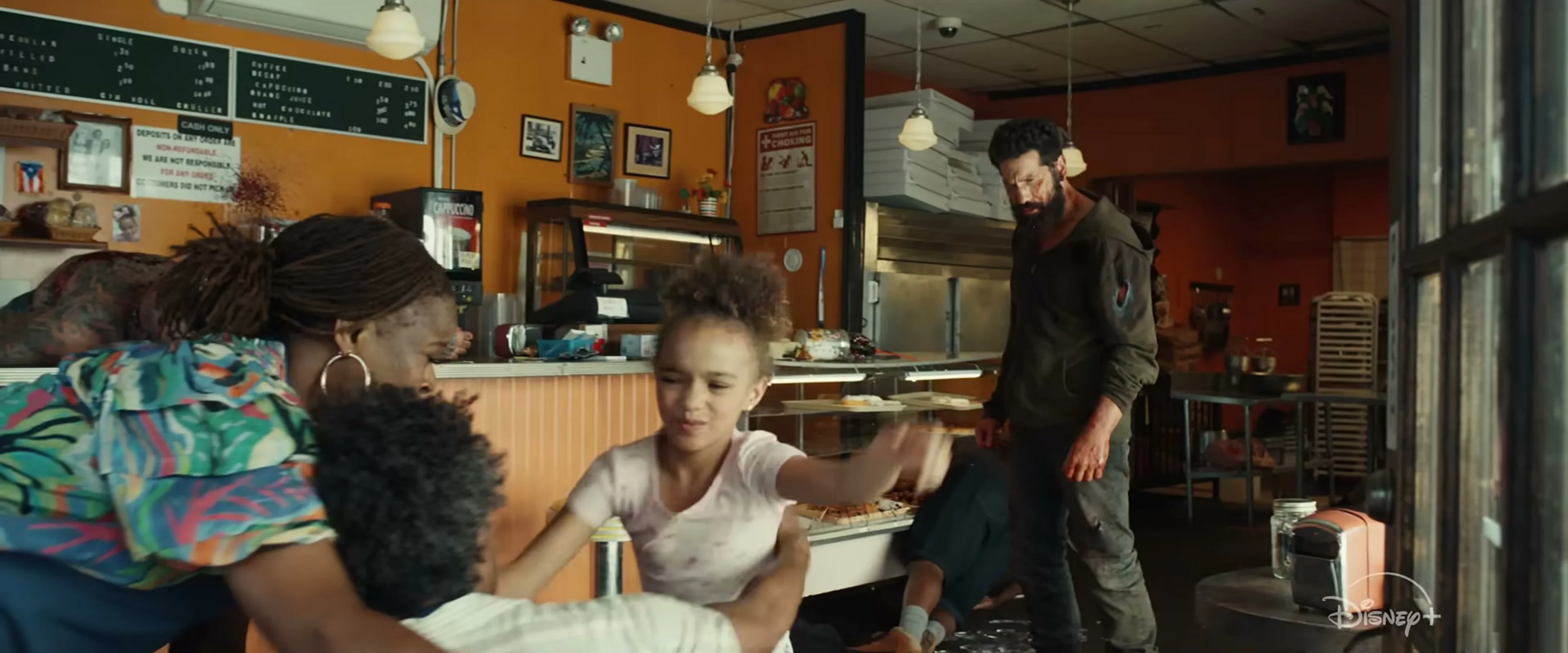 Jon Bernthal stands inside a neighborhood cafe in The Punisher: One Last Kill.