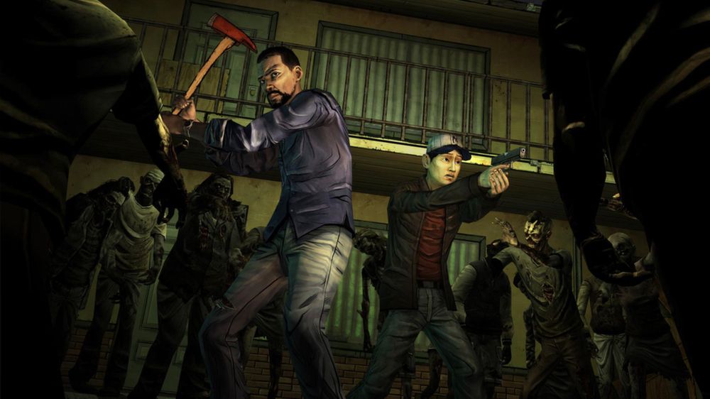 Lee raises an axe while another survivor points a gun at surrounding walkers.