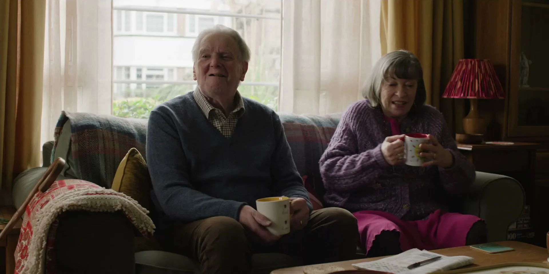 Geoff and Birdie sit together at home in Tender Loving Care.