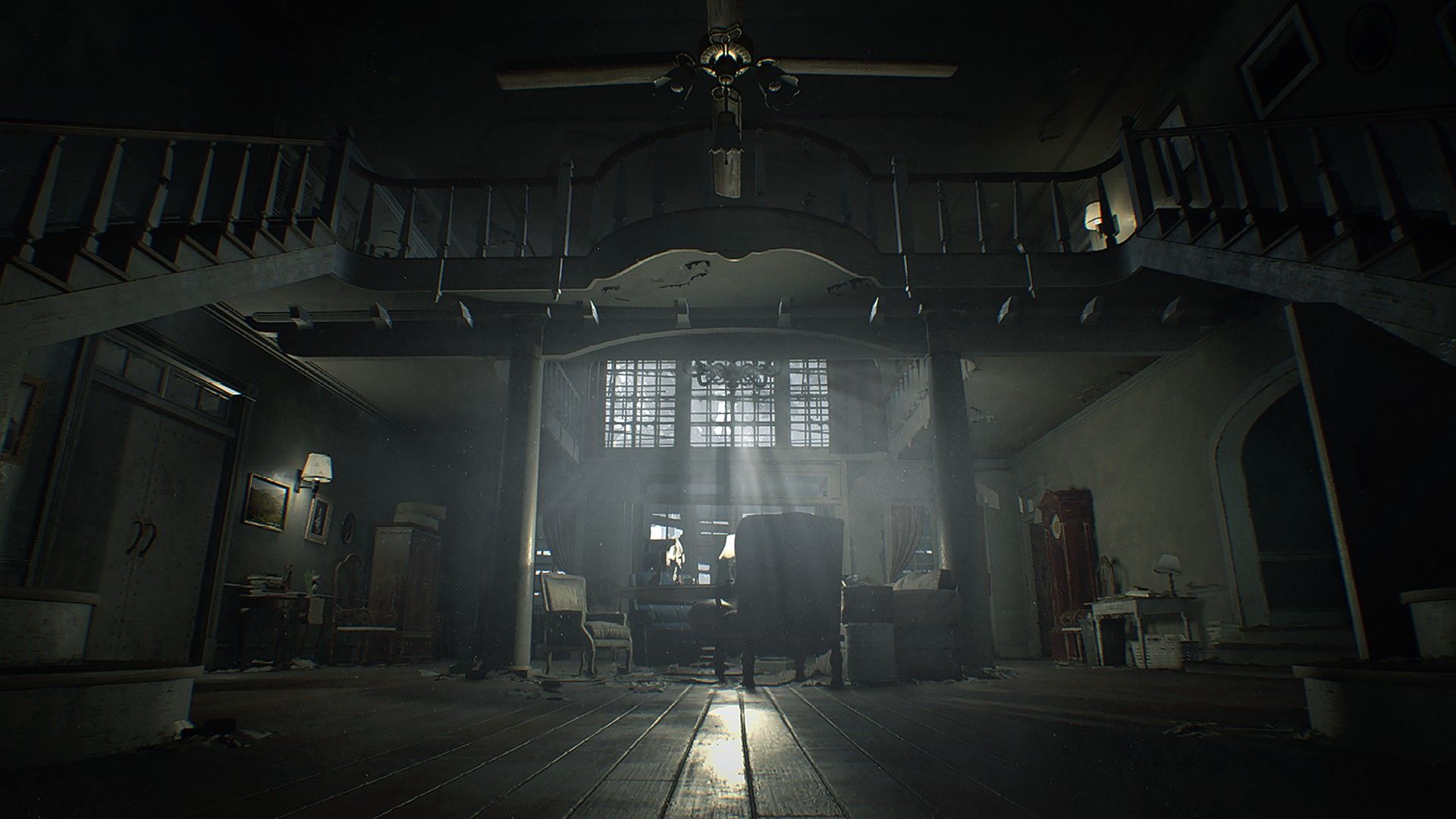 A dark room inside the Baker property has a bright doorway in the distance.