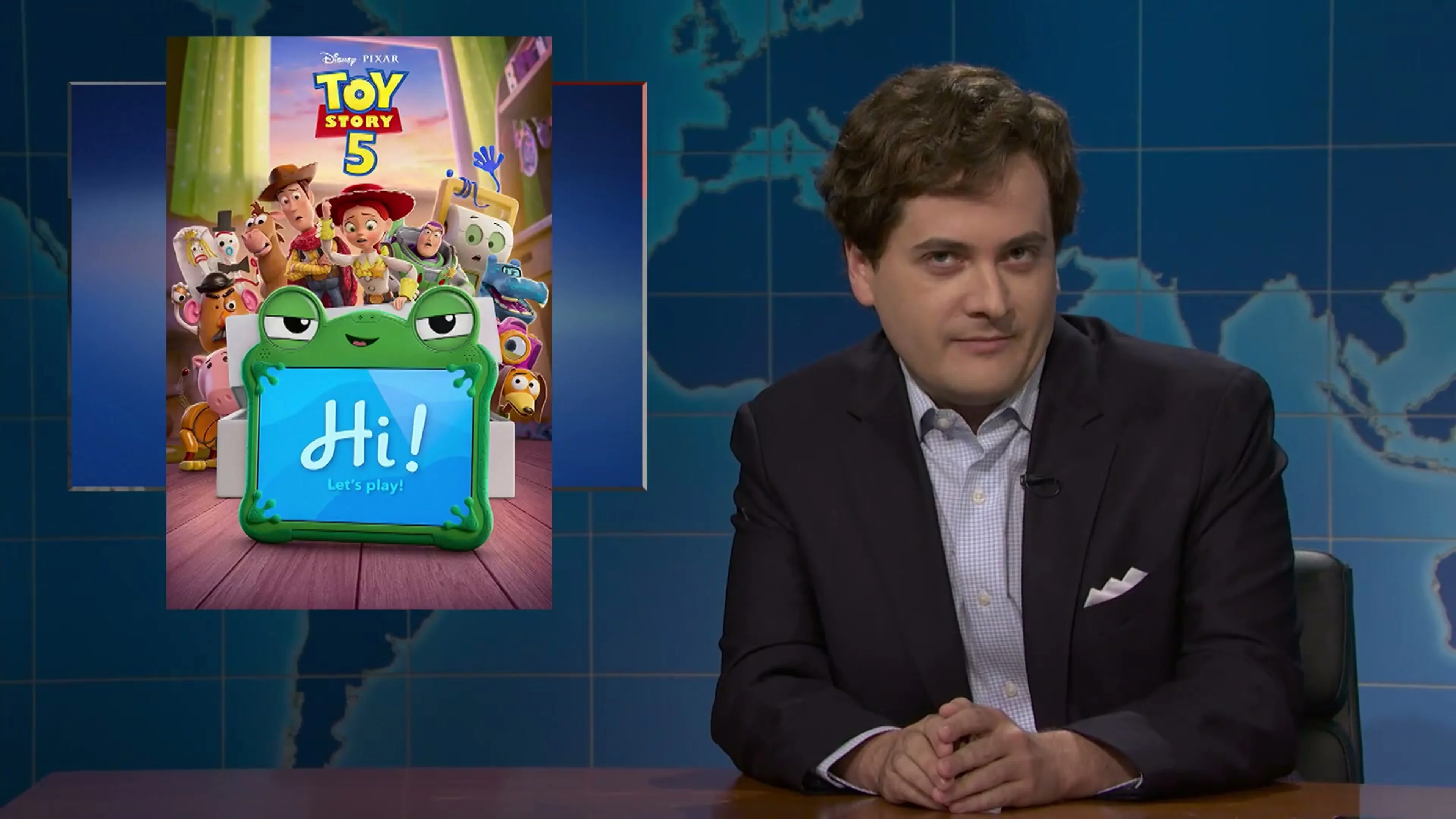 Jeremy Culhane as Tucker Carlson sits beside a Toy Story 5 poster on Saturday Night Live.